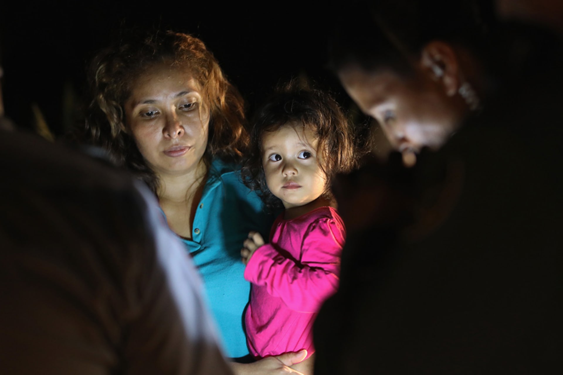 <p>Central American asylum seekers, including a Honduran girl, 2, and her mother, are taken into custody near the U.S.-Mexico border on June 12, 2018 in McAllen, Texas.</p>
