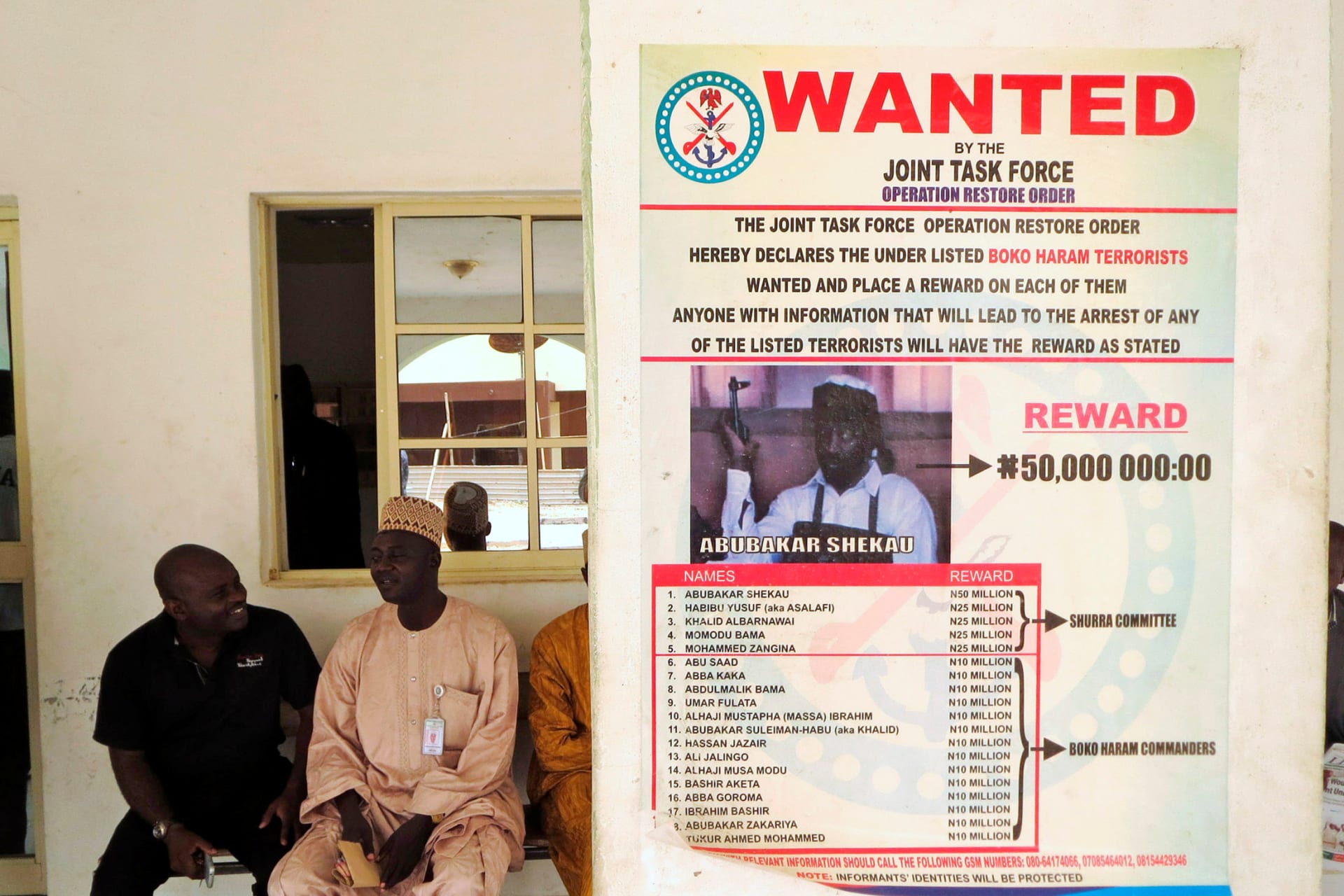 <p>A poster advertising for the search of Boko Haram leader Abubakar Shekau is pasted on a wall in Baga village on the outskirts of Maiduguri, in the northeastern state of Borno, Nigeria May 13, 2013.</p>
