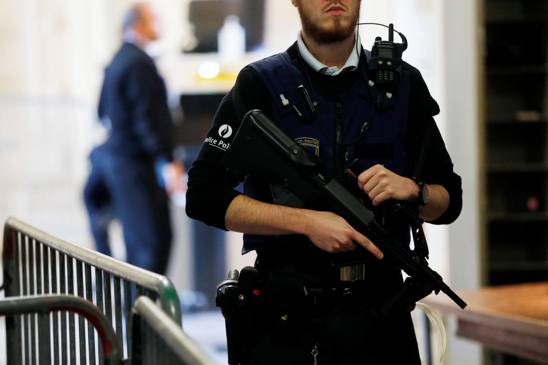 <p>A Belgian police officer stands guard outside a courtroom during the trial of one of the suspects in the 2015 Islamic State attacks.</p>
