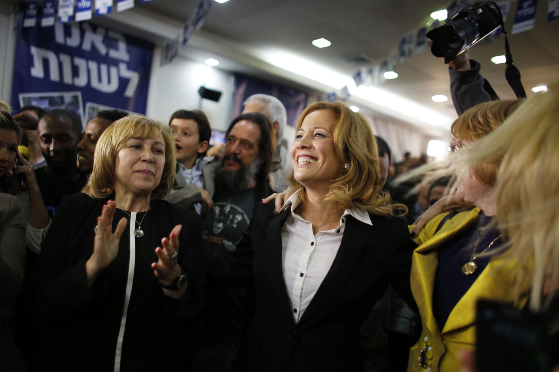 <p>Dr. Aliza Lavie celebrates exit poll results at the Yesh Atid party’s headquarters in Tel Aviv.</p>
