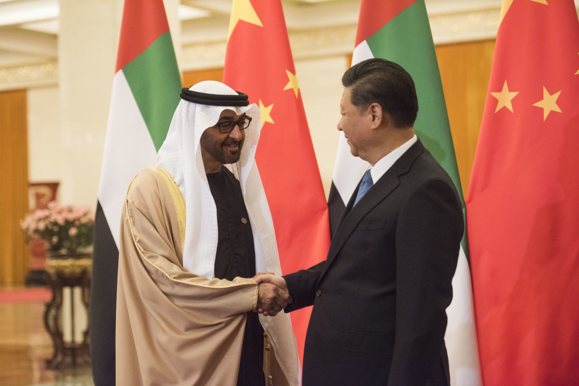 <p>Sheikh Mohammed bin Zayed al-Nahyan (L), Crown Prince of Abu Dhabi and UAE’s deputy commander-in-chief of the armed forces shakes hands with Chinese President Xi Jinping (R) at the Great Hall of the People, Beijing, December 14, 2015</p>
