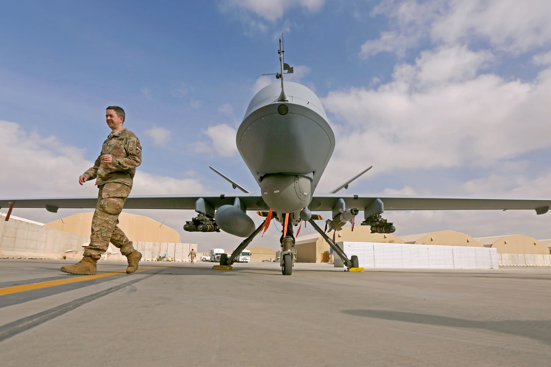<p>A U.S. service member passes in front of a MQ-9 Reaper drone, one of a squadron that has arrived to step up the fight against the Taliban, at the Kandahar air base, Afghanistan January 23, 2018.</p>
