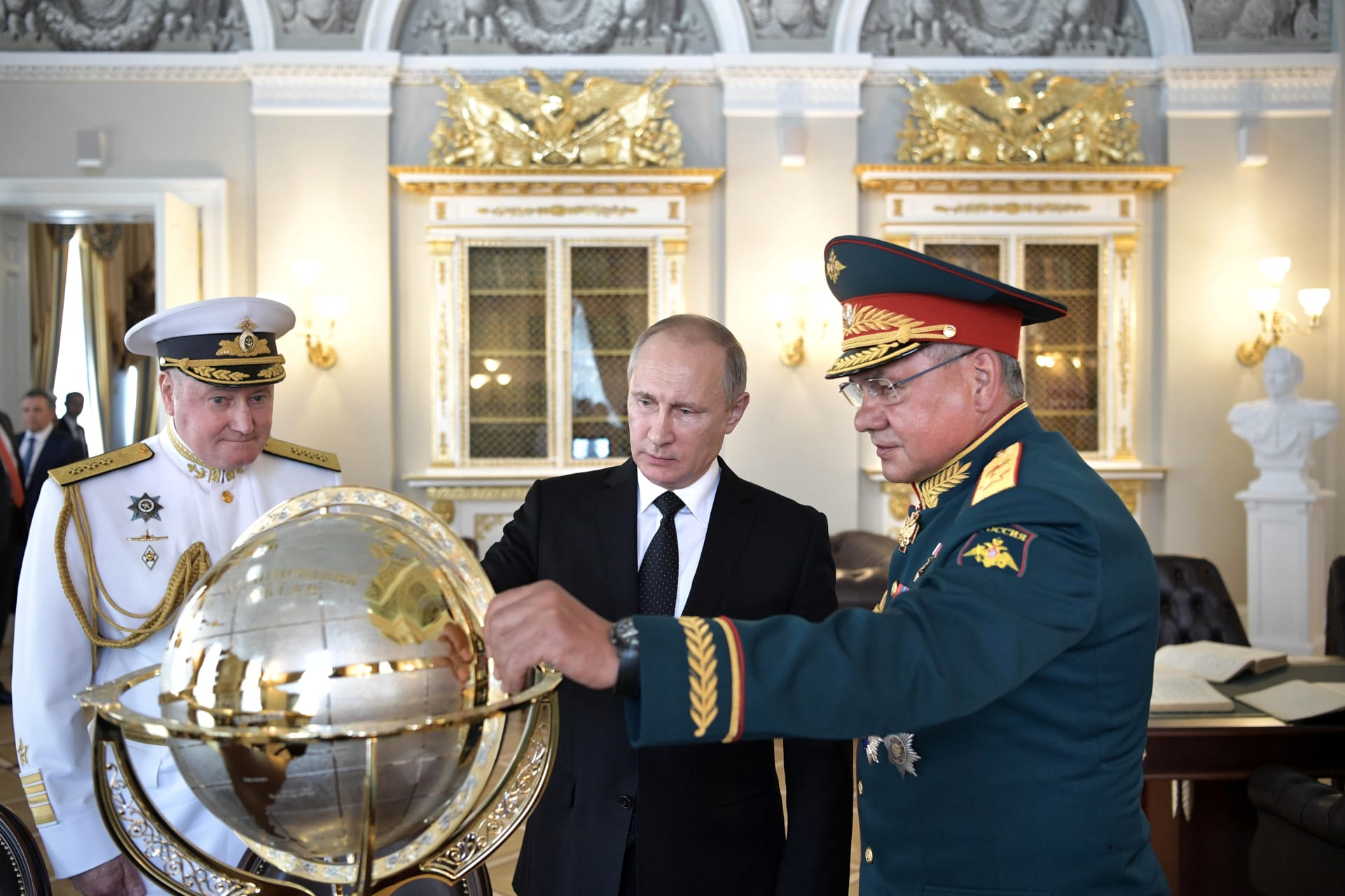<p>Russian President Vladimir Putin (C), Defence Minister Sergei Shoigu (R) and Commander-in-Chief of the Russian Navy Vladimir Korolev visit the Admiralty historical building on the Navy Day in St. Petersburg, Russia, July 30, 2017</p>
