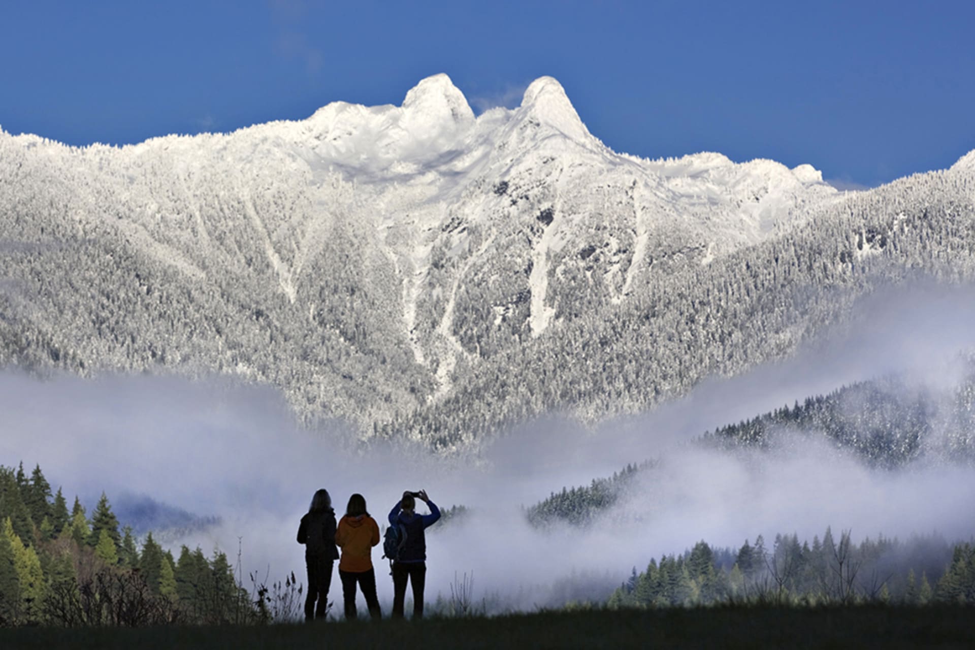 <p>Visitors explore the mountains of British Columbia, near Canada’s Pacific coast, in 2012.</p>
