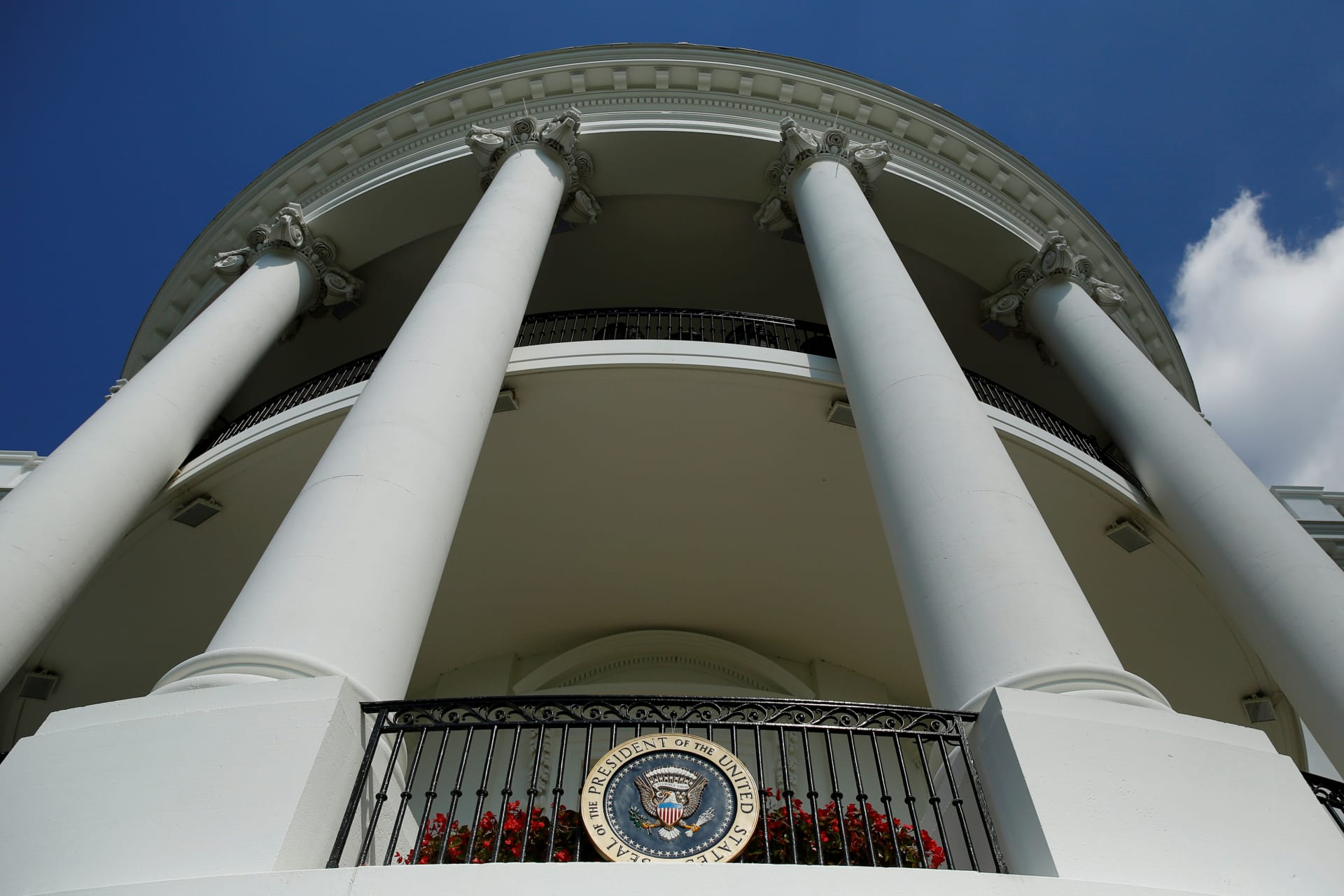 <p>The White House’s Truman Balcony and the Presidential seal. </p>
