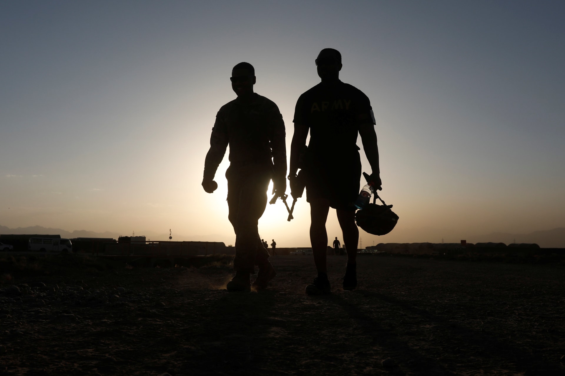 <p>U.S. troops walk at their base in Logar province.</p>
