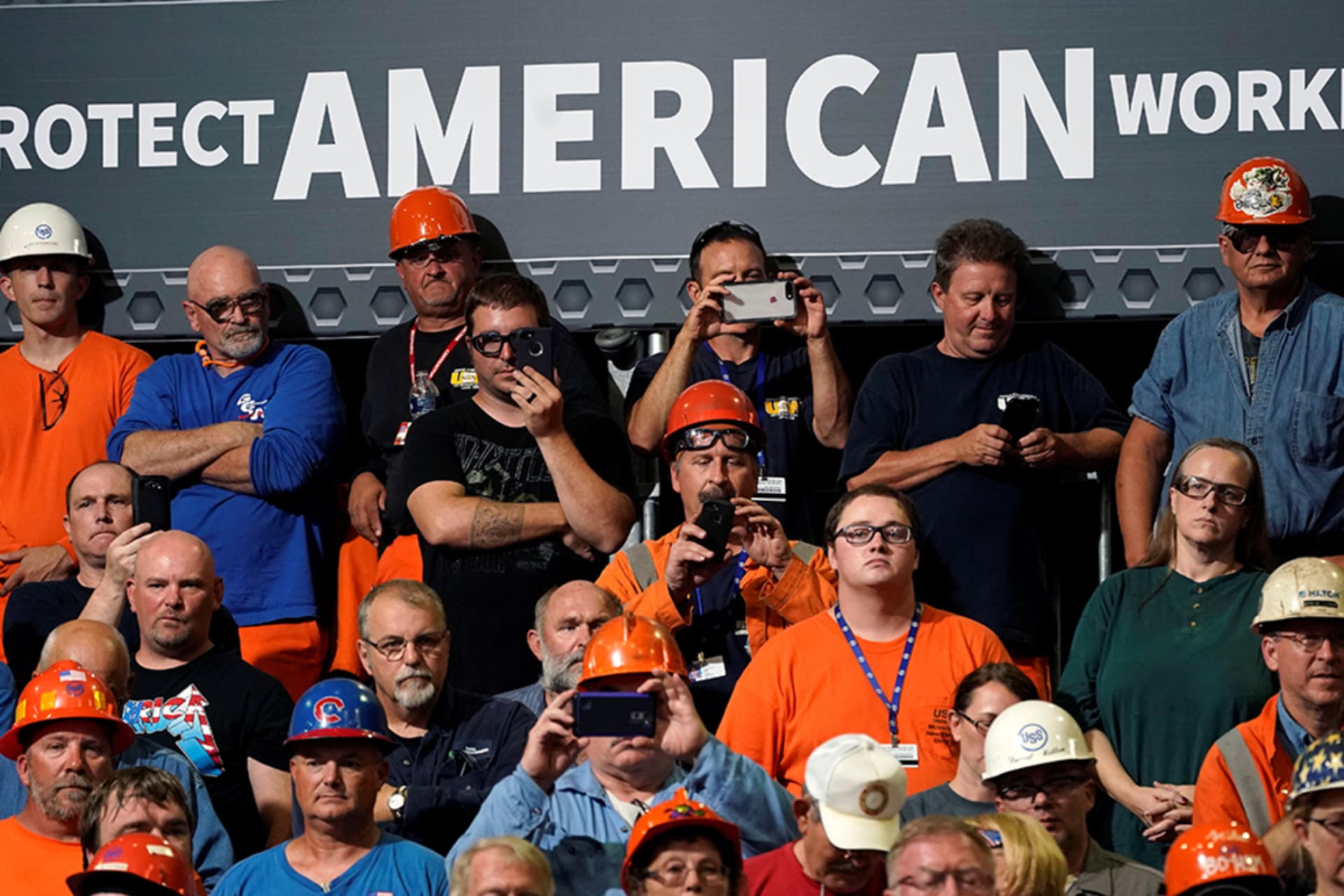 <p>Steelworkers watch President Donald J. Trump speak about trade policy at a steel plant in Granite City, Illinois, on July 26, 2018.</p>
