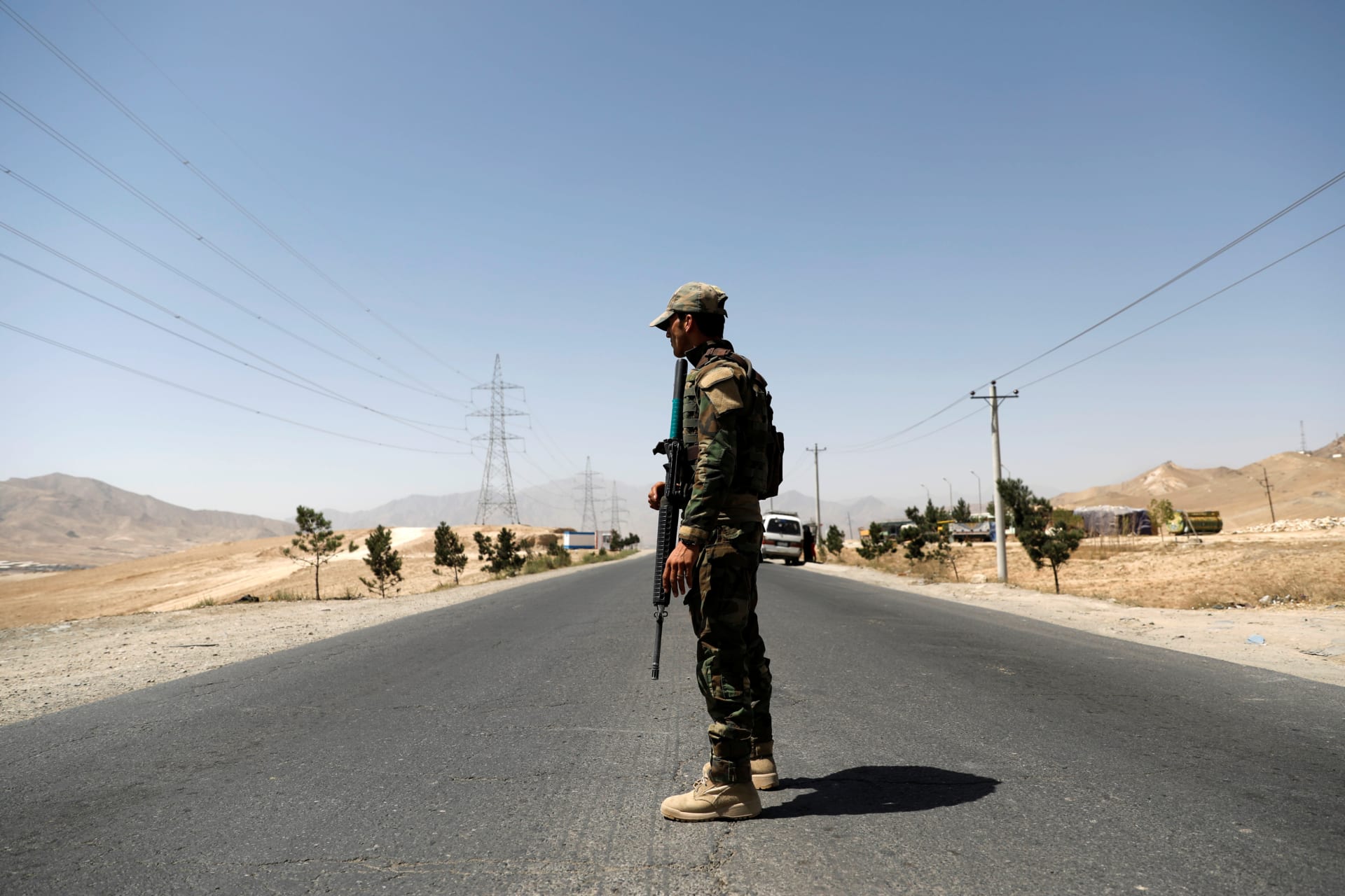 <p>An Afghan National Army soldier keeps watch at a checkpoint on the Ghazni highway in Afghanistan on August 12, 2018.</p>
