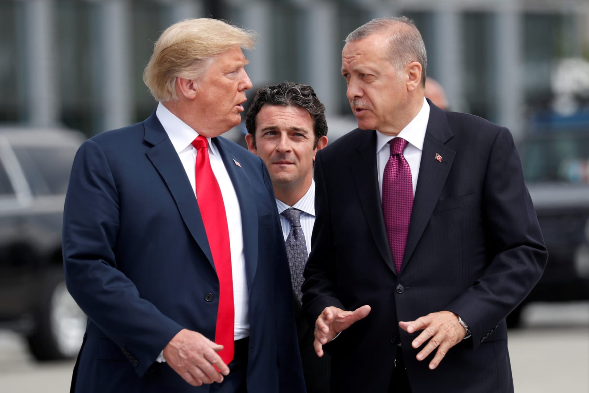 <p>U.S. President Donald Trump and Turkish President Tayyip Erdogan gesture as they talk at the start of the NATO summit in Brussels, Belgium on July 11, 2018.</p>

