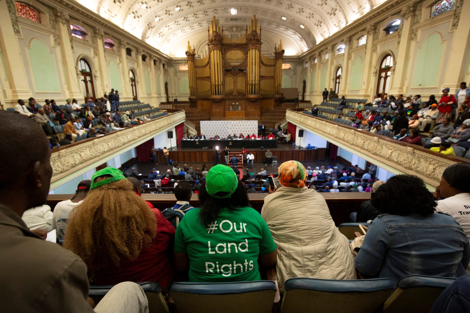 <p>People listen from the gallery as the Constitutional Review Committee hold public hearings regarding expropriation of land without compensation in Pietermaritzburg, South Africa July 20, 2018.</p>
