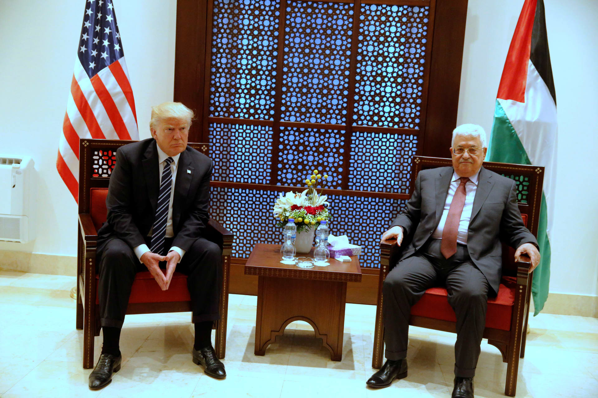 <p>U.S. President Donald Trump (L) and Palestinian President Mahmoud Abbas wait for photographers to depart before beginning their meeting at the Presidential Palace in the West Bank city of Bethlehem </p>
