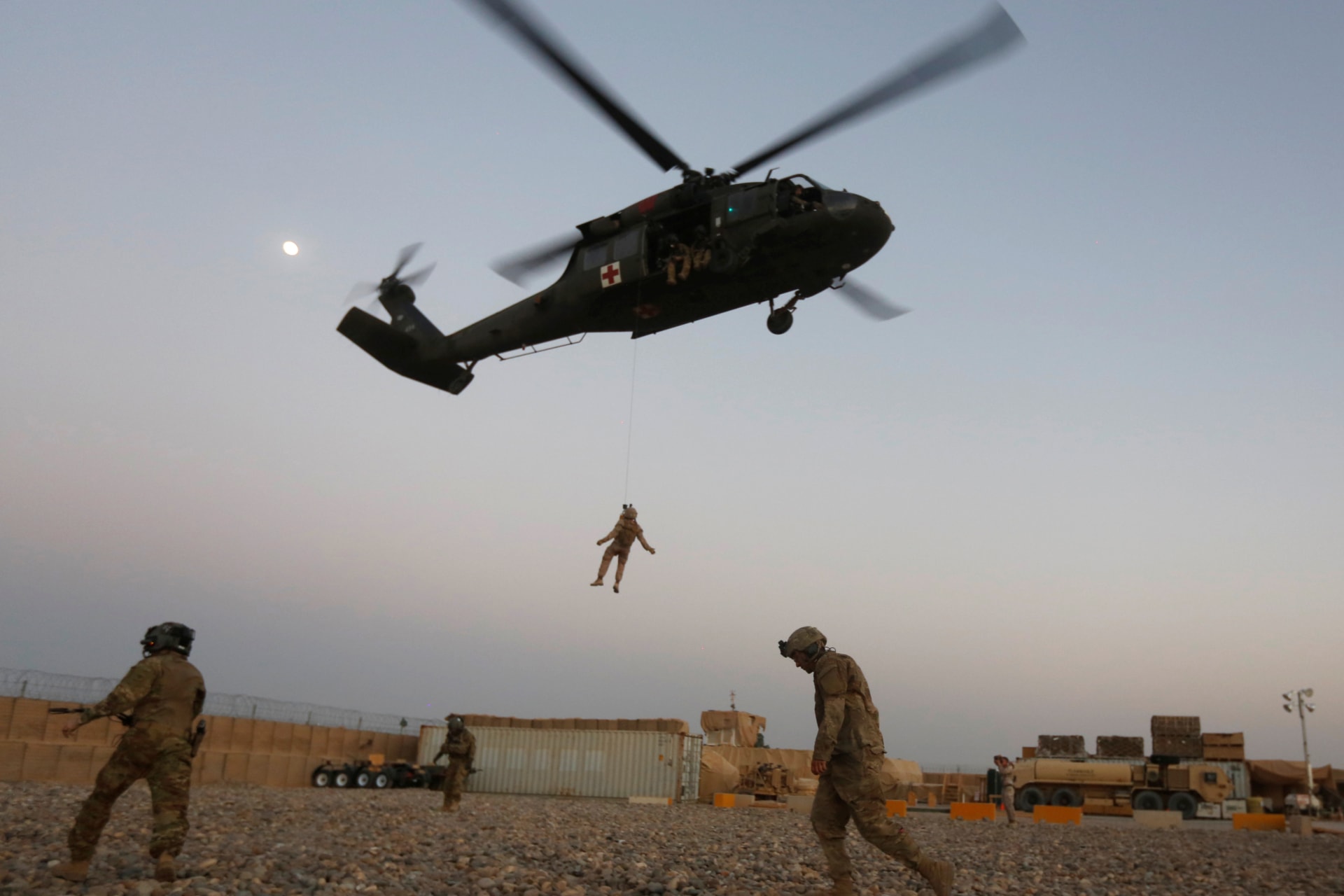 <p>U.S. service members take part in a helicopter Medevac exercise.</p>
