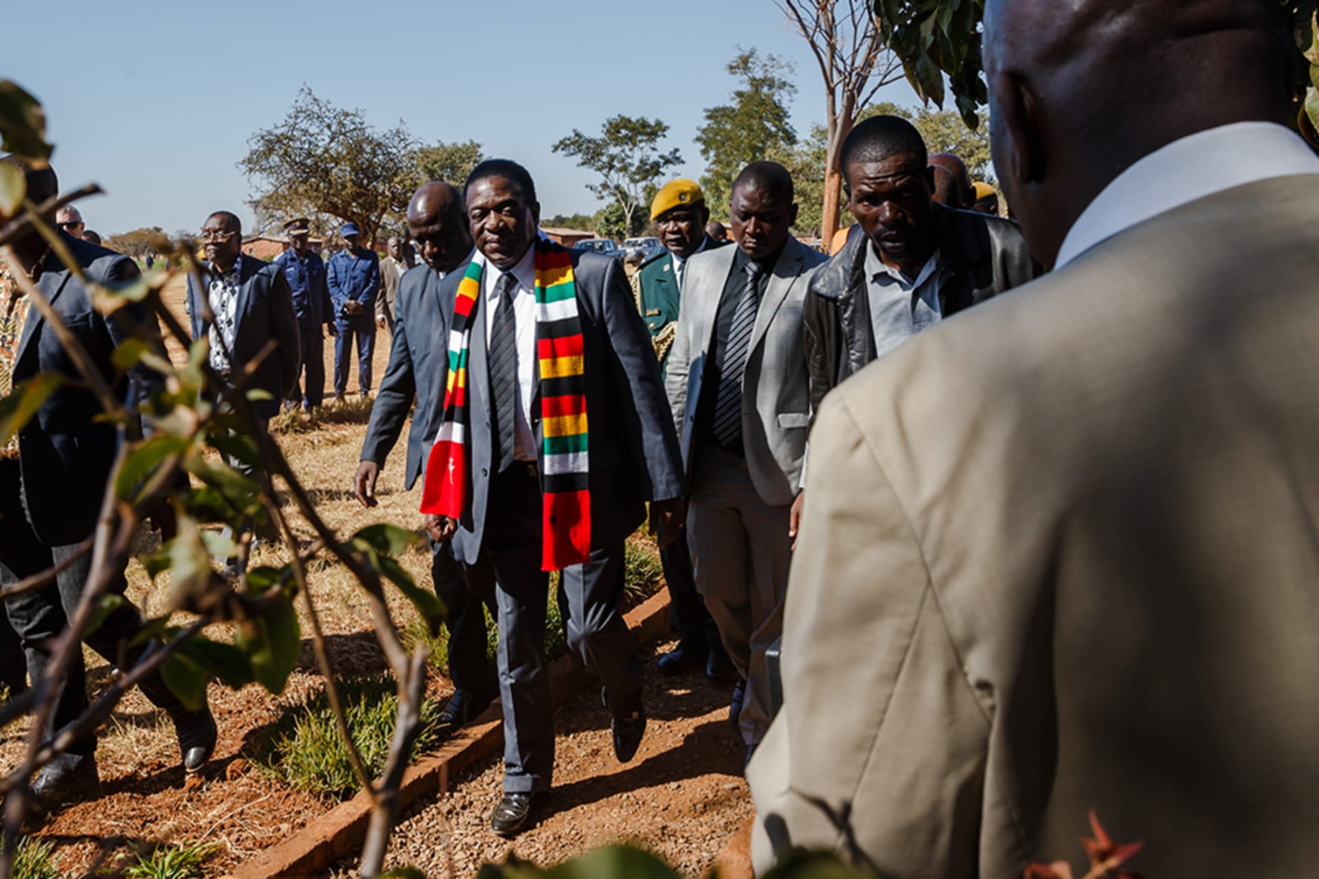<p>Zimbabwe President Emmerson Mnangagwa leaves the polling station after casting his ballot at Sherwood Primary School in Kwekwe on July 30 2018, during general elections.</p>
