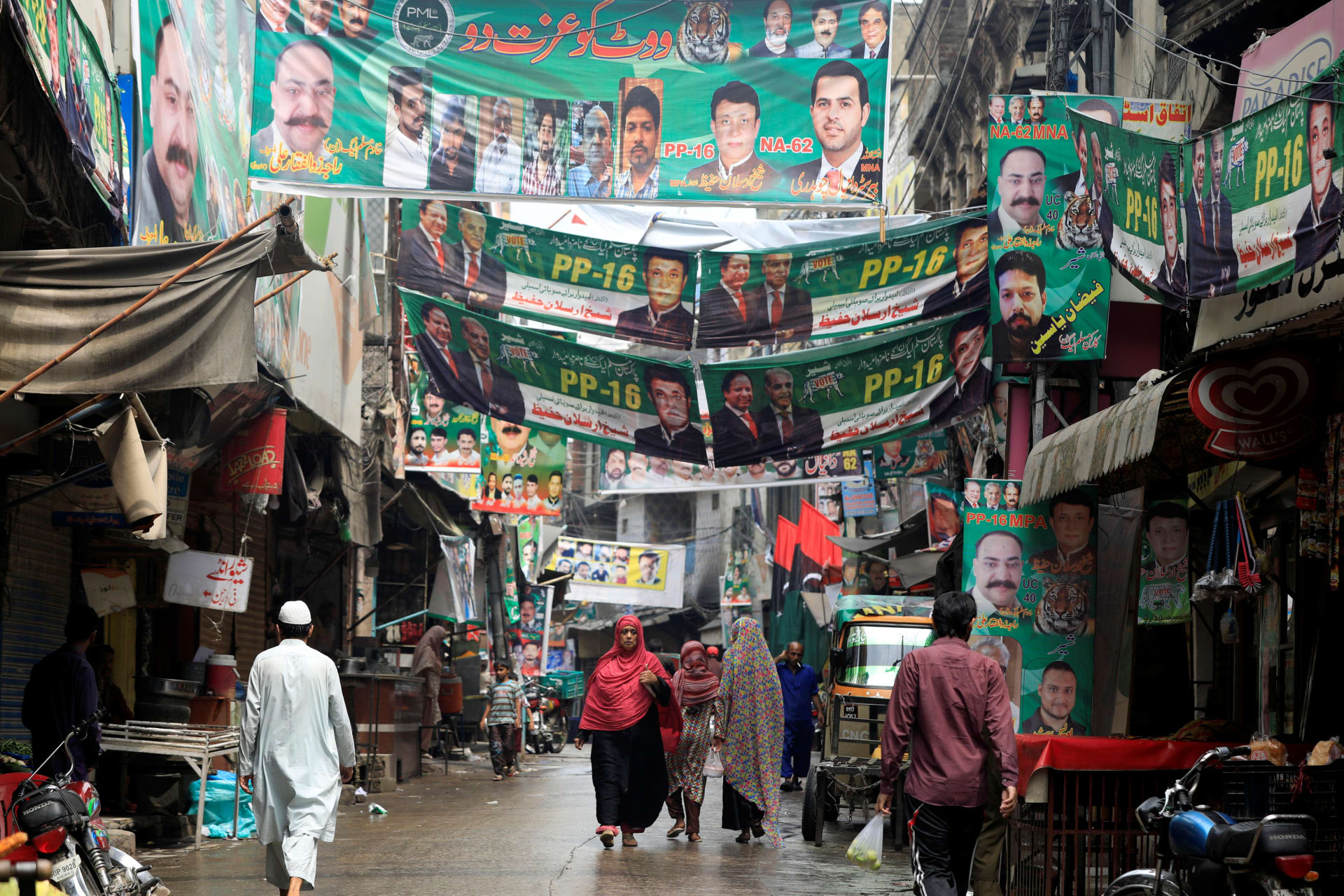 <p>A street is decorated with the flags and banners of political parties ahead of a general election in Rawalpindi, Pakistan, on July 23, 2018.</p>

