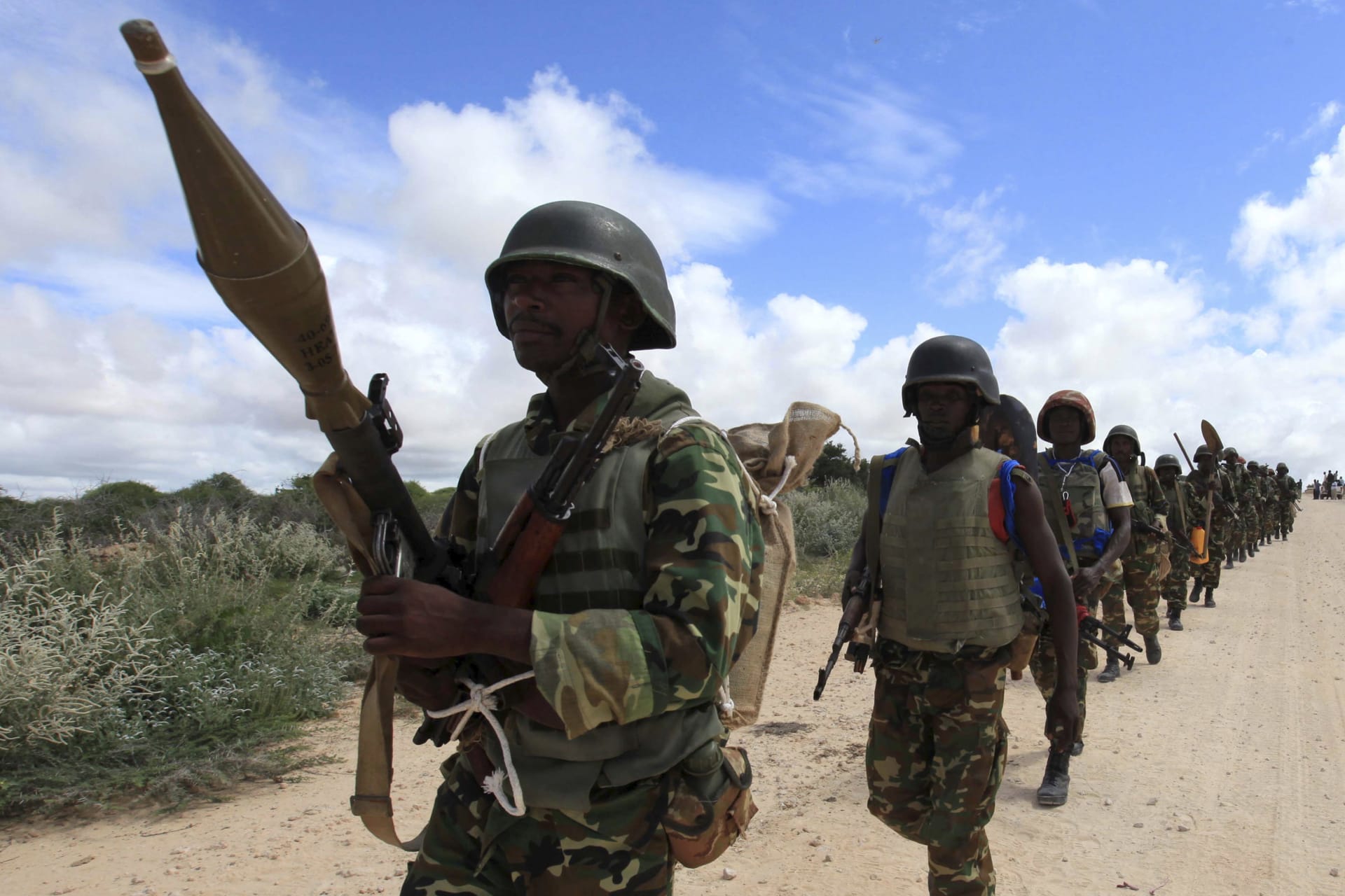 <p>African Union Mission in Somalia (AMISOM) peacekeepers patrol after fighting between insurgents and government soldiers erupted on the outskirts of Mogadishu in May 2012.</p>
