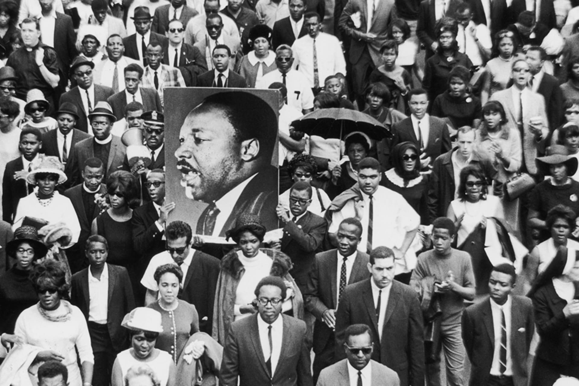<p>Mourners take part in a procession following the death of civil rights leader Martin Luther King, Jr., whose assassination was among the pivotal events of 1968.</p>
