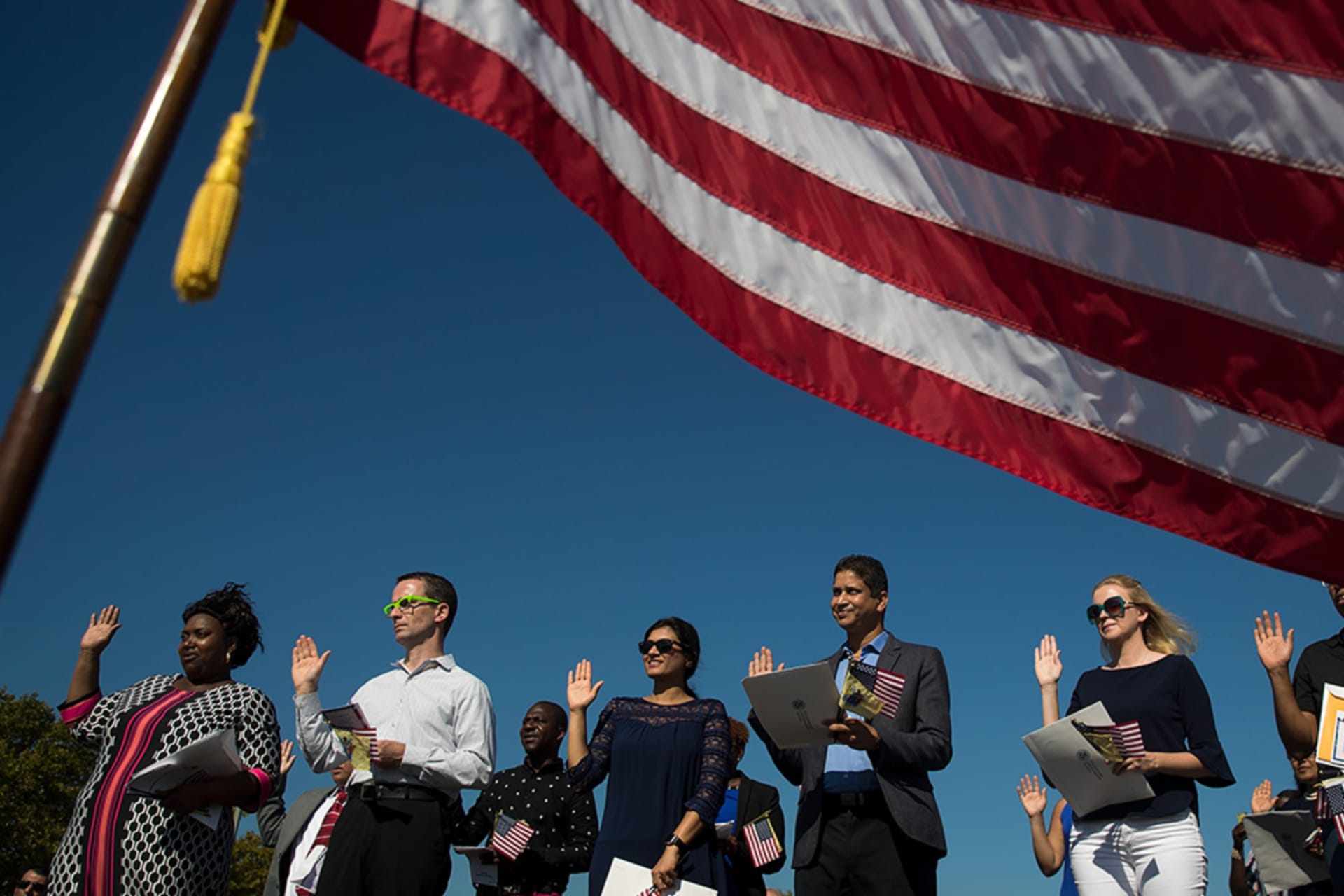 <p>Immigrants become naturalized U.S. citizens by taking the oath of allegiance in Jersey City, New Jersey, in 2017. </p>
