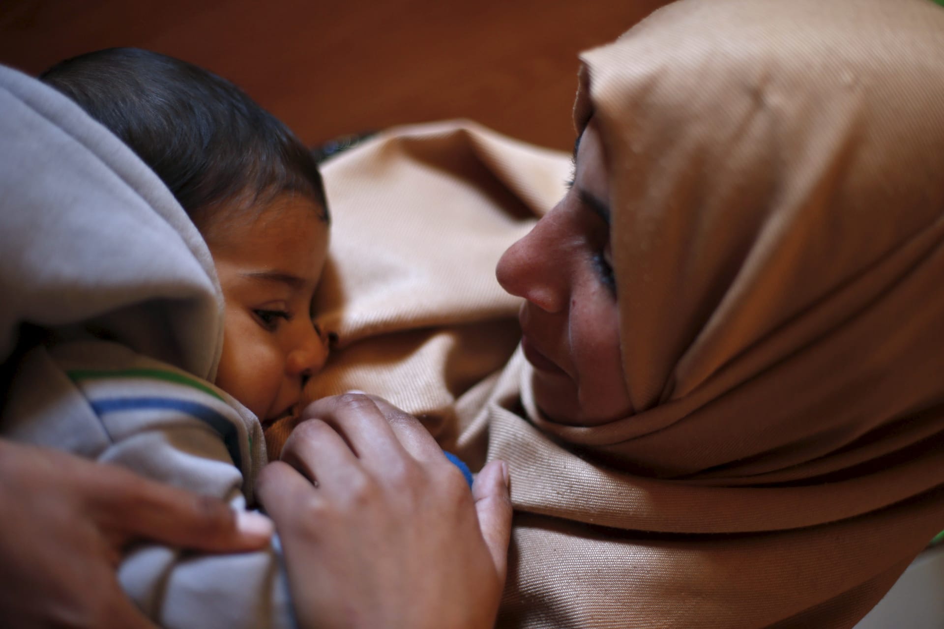 <p>Syrian refugee Burooq Al Zubi, 21, breastfeeds her nine-month-old son Fares at Al Zaatari refugee camp in the Jordanian city of Mafraq.</p>
