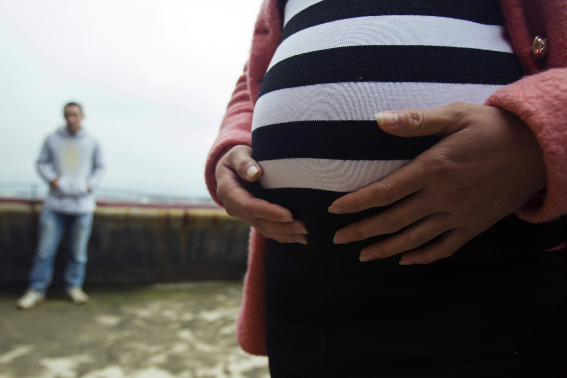 <p>Lu Libing and his pregnant wife, Mu, pose for pictures during an interview with Reuters at their home in Ganzhou, Jiangxi province March 13, 2014. </p>
