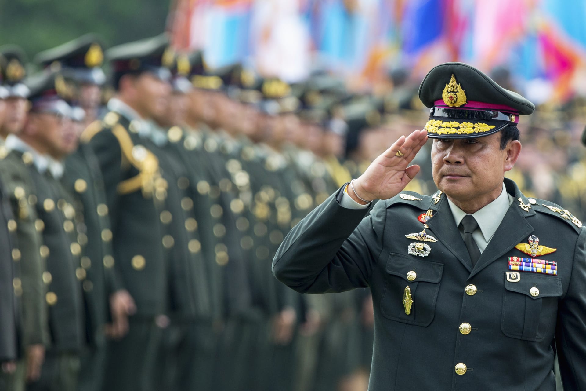 <p>Thailand’s Prime Minister Prayuth Chan-ocha salutes members of the Royal Thai Army after a handover ceremony for the new Royal Thai Army Chief, General Udomdej Sitabutr, at the Thai Army Headquarters in Bangkok on September 30, 2014.</p>
