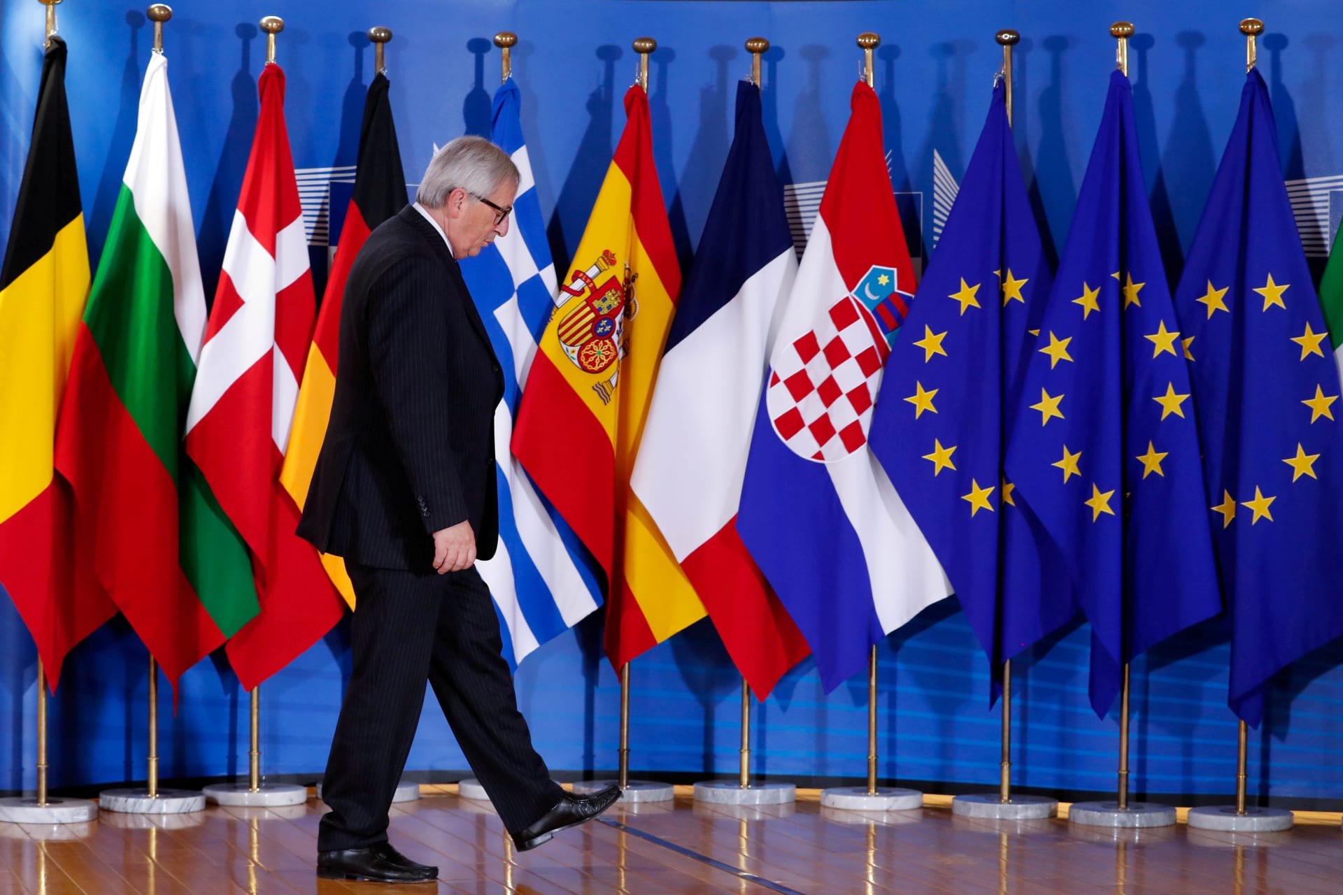 <p>European Commission President Jean-Claude Juncker waits for guests at the start of an emergency European Union leaders summit in Brussels on June 24, 2018.</p>
