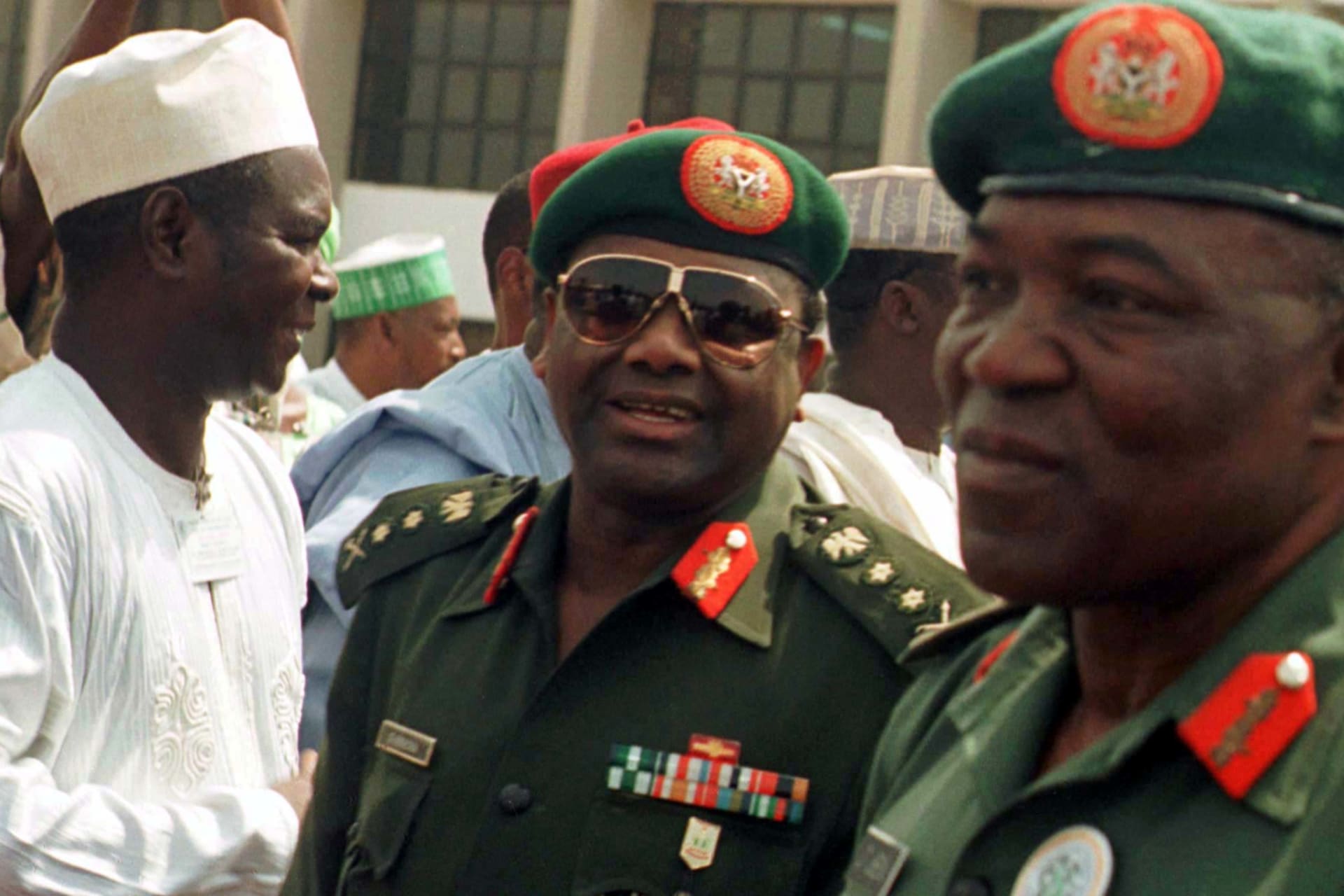 <p>Nigerian military ruler General Sani Abacha (C) arrives for the commissioning of the Sani Abacha Foundation for Peace and Unity in the capital Abuja four years after taking power, on November 17, 1997.</p>
