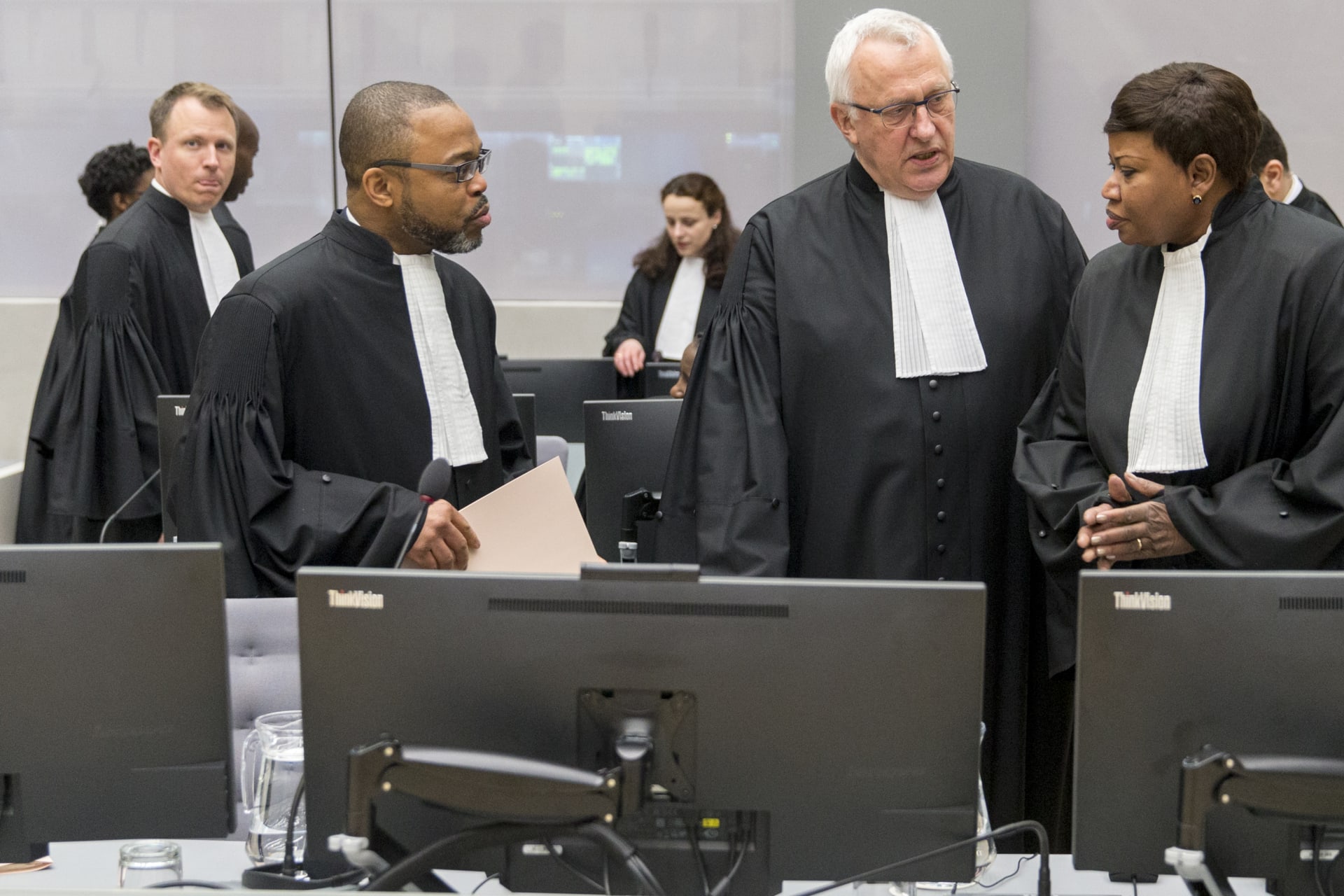 <p>Jean-Jacques Badibanga,  James Stewart, and Chief Prosecutor Fatou Bensouda are seen in a court room of the ICC before the delivery of the judgment in the case of Jean-Pierre Bemba in the Hague, 2016.</p>
