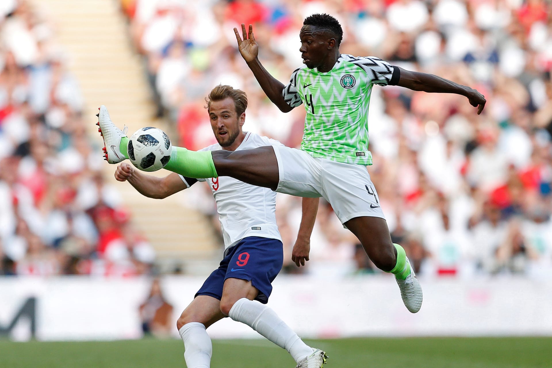 <p>Nigeria’s Kenneth Omeruo in action with England’s Harry Kane Action on June 2, 2018 </p>
