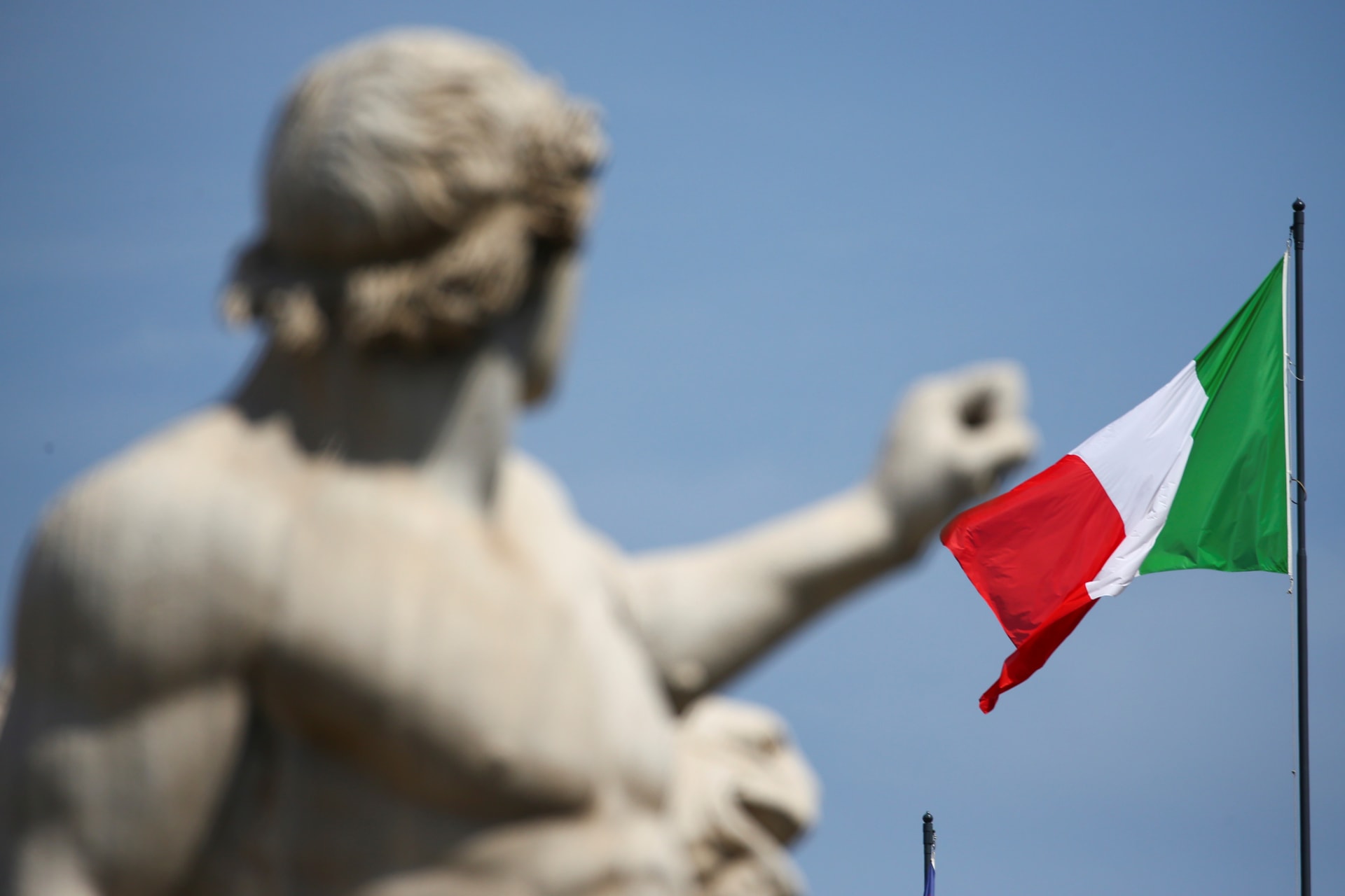 <p>The Italian flag waves over the Quirinal Palace in Rome.</p>

