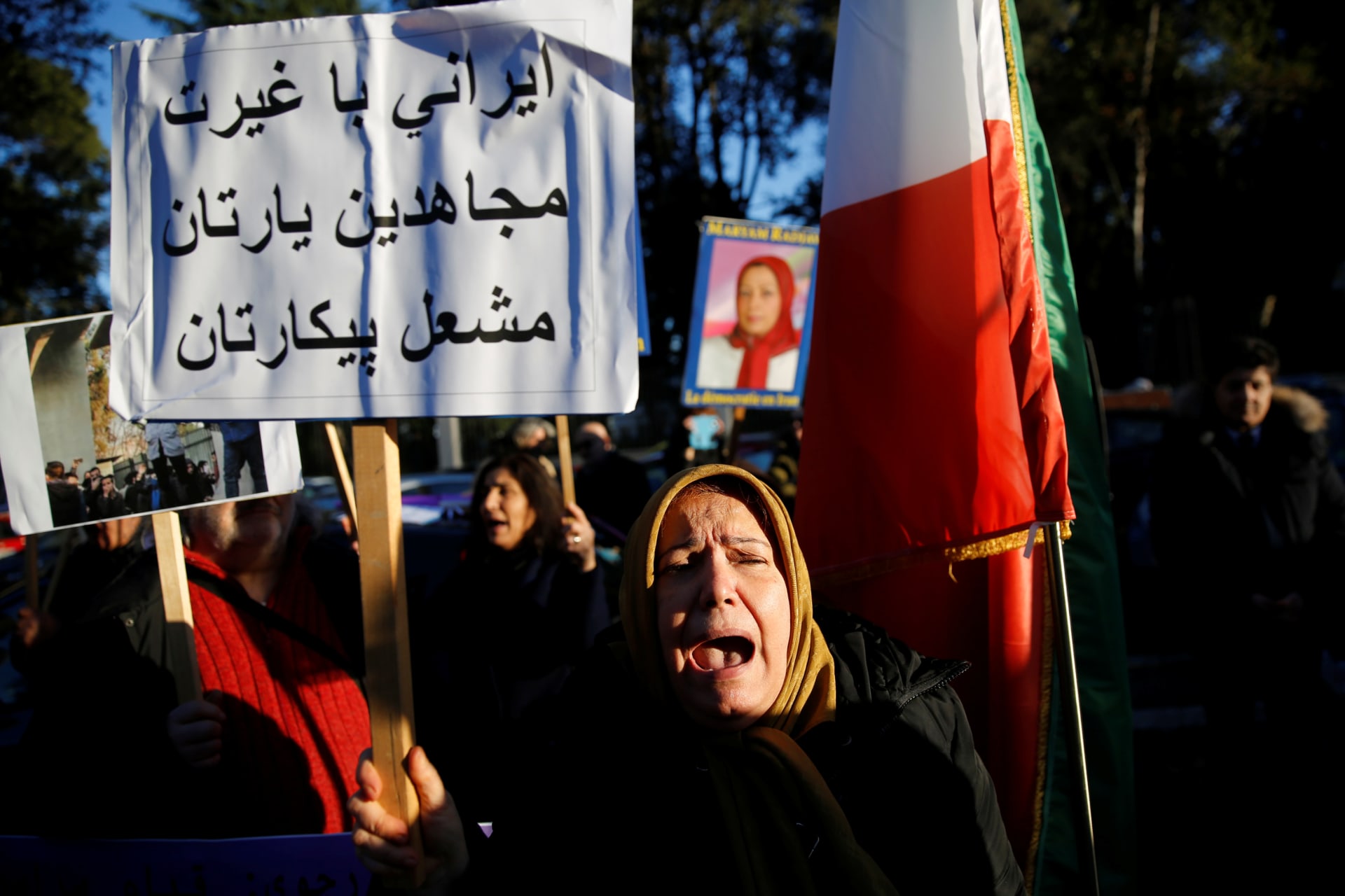 <p>Opponents of Iranian President Hassan Rouhani hold a protest outside the Iranian embassy in Rome, Italy, on January 2, 2018.</p>
