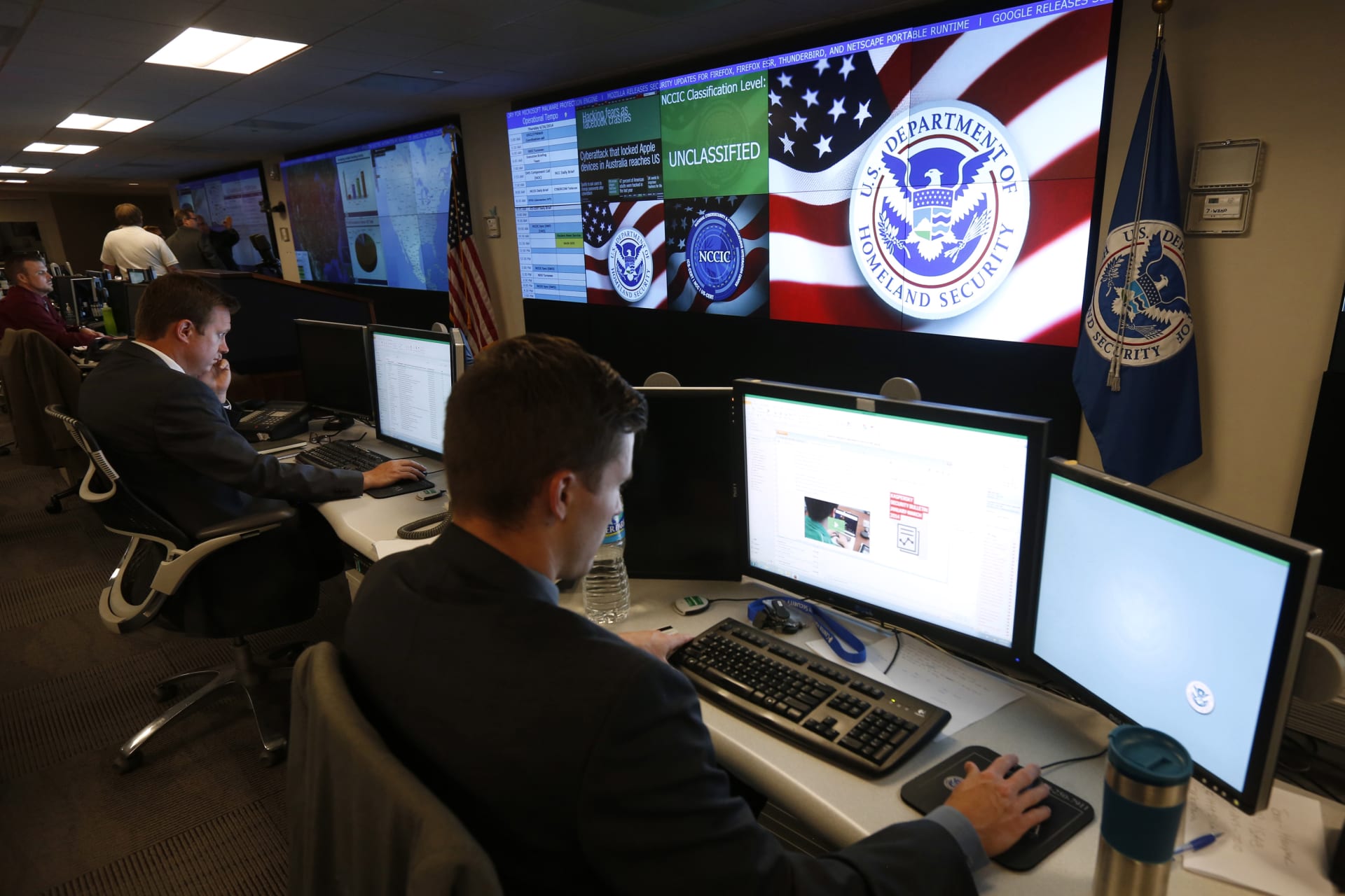 <p>U.S. Department of Homeland Security employees work during a guided media tour inside the National Cybersecurity and Communications Integration Center in Arlington, Virginia on June 26, 2014</p>
