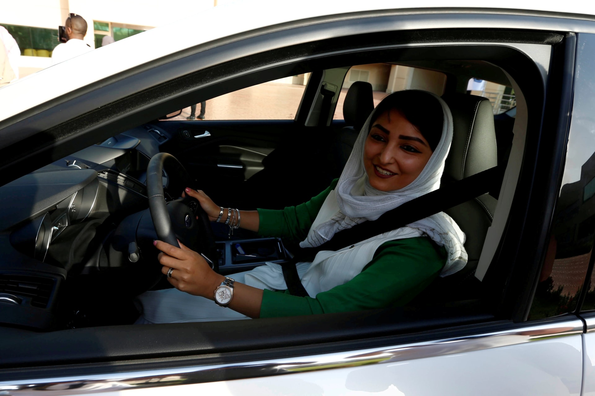 <p>Saudi woman sits in a car during a driving training at a university in Jeddah.</p>
