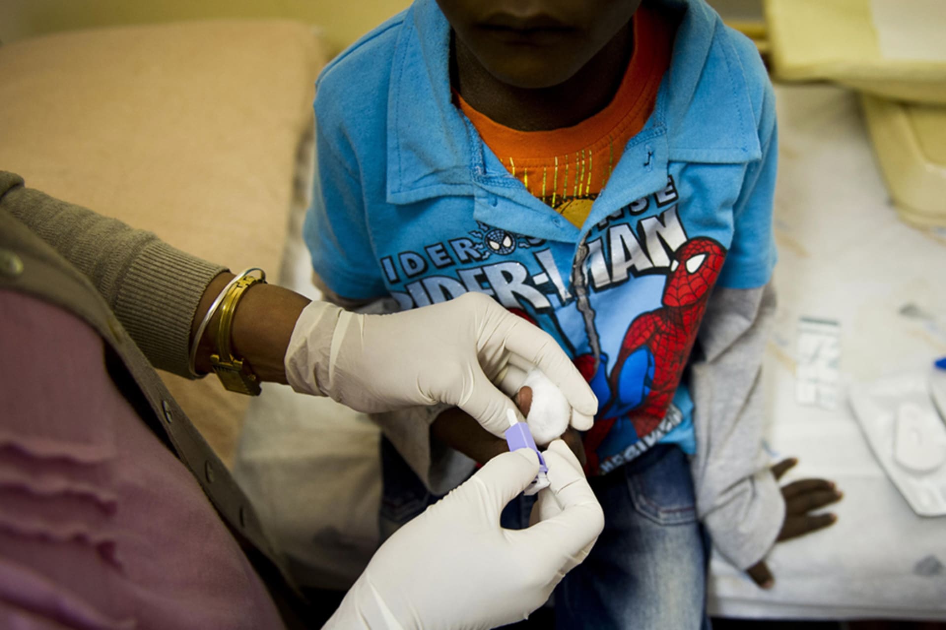 <p>A nurse administers an HIV test on a young boy at a PEPFAR-funded AIDS clinic in Johannesburg, South Africa. </p>
