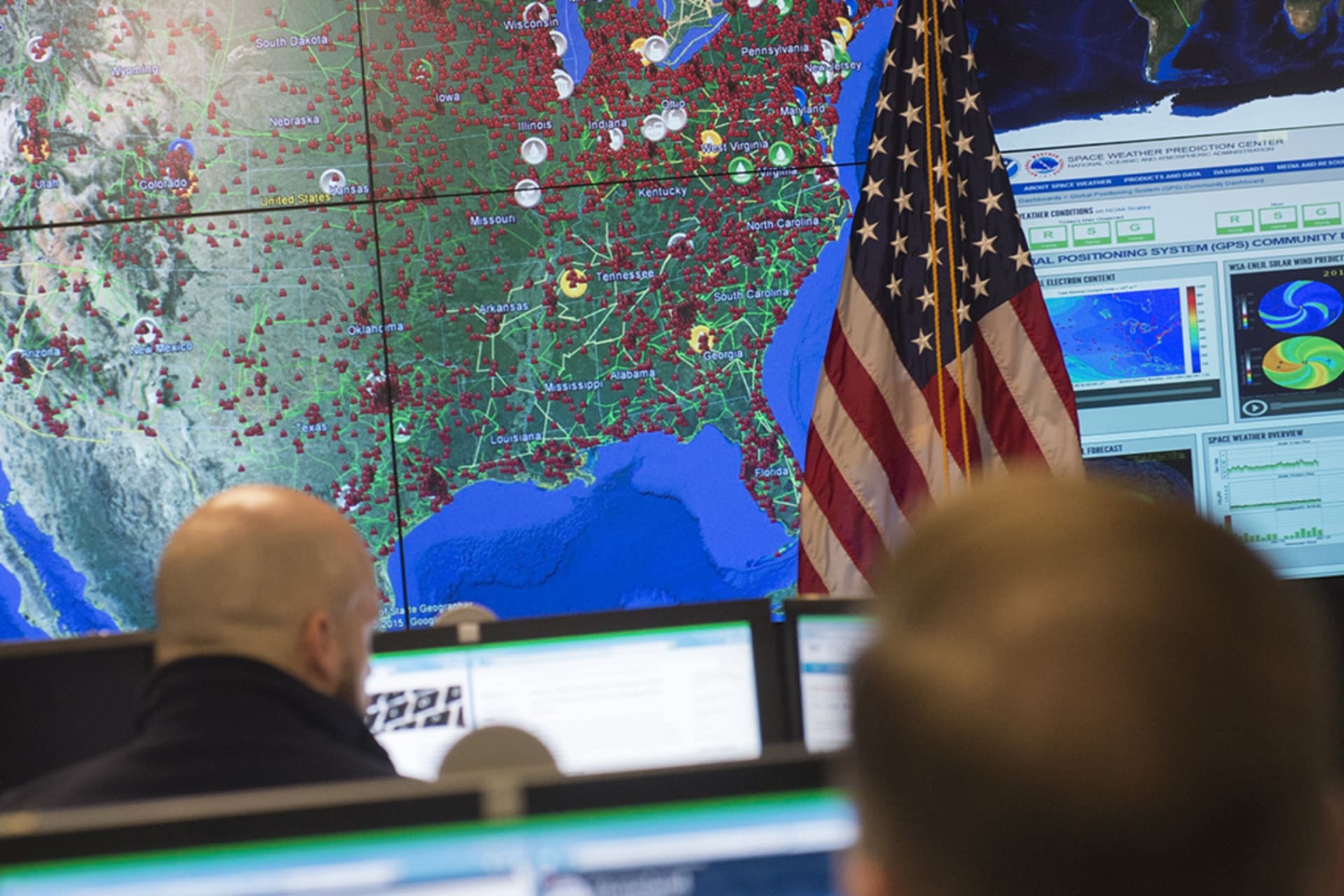 <p>Staff members sit at their work stations at the National Cybersecurity and Communications Integration Center in Arlington, Virginia on January 13, 2015.</p>
