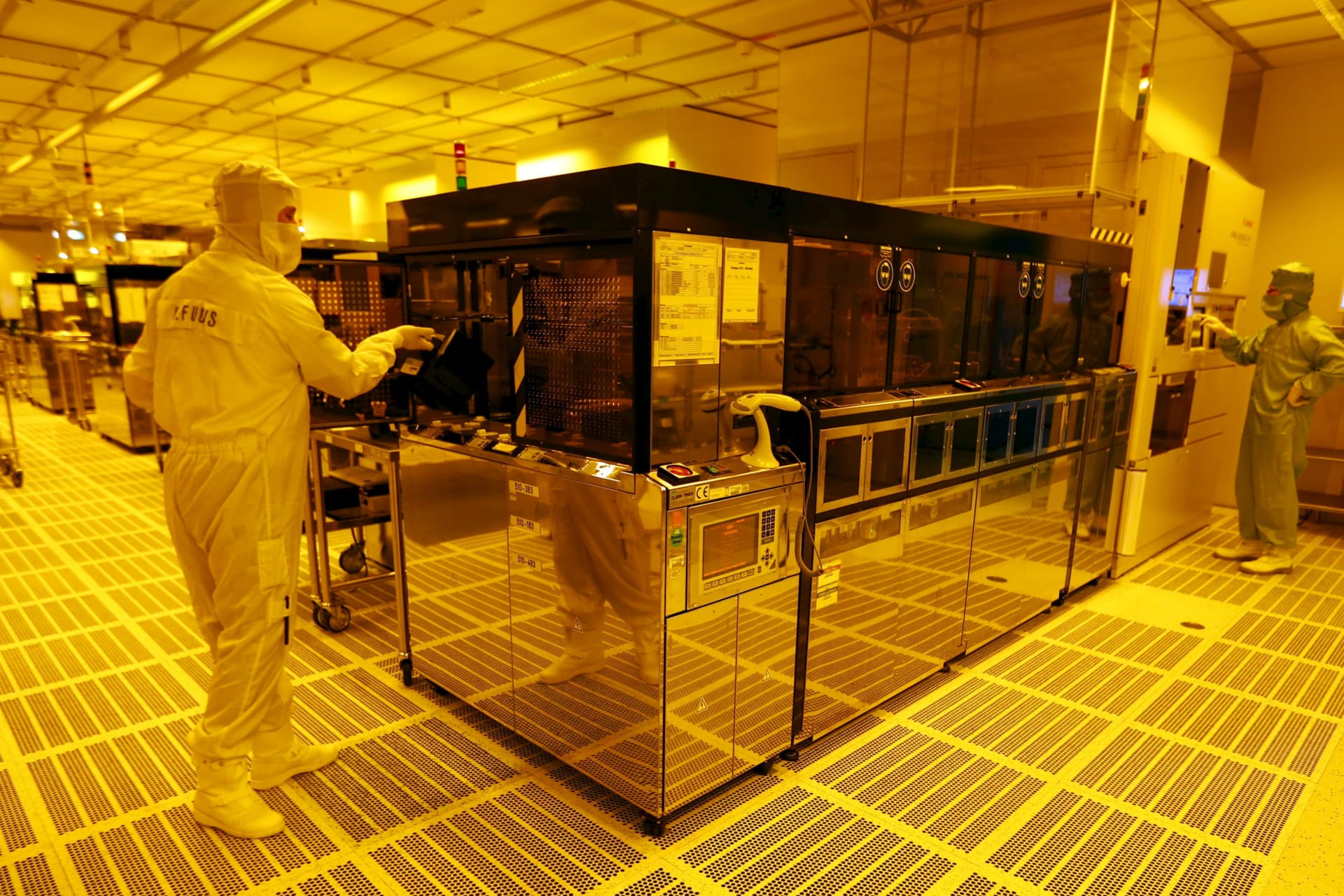 <p>An employee is pictured inside a clean room of German semiconductor manufacturer Infineon in Regensburg on February 12, 2013.</p>
