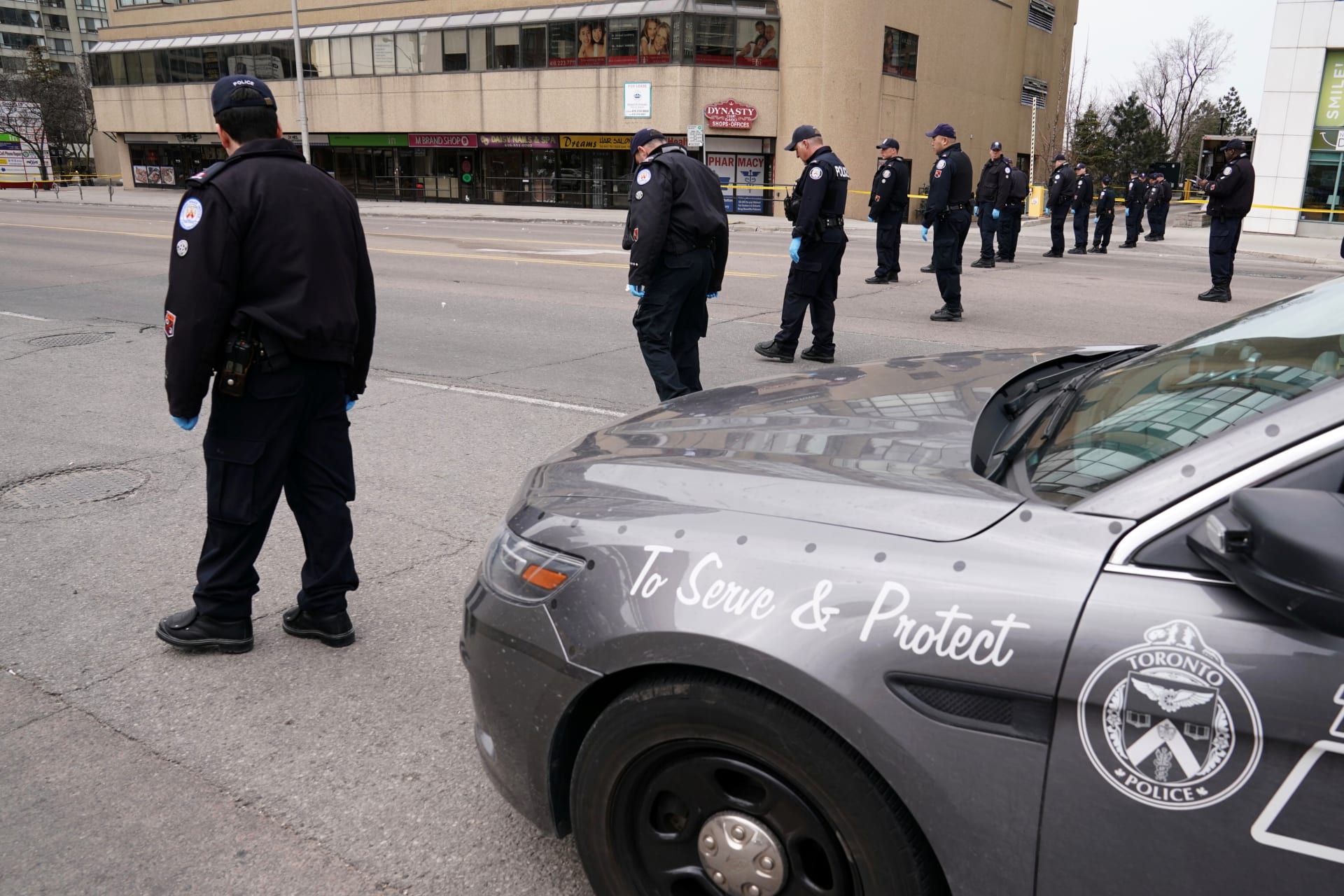 <p>Police officers comb a street for evidence after a van struck multiple people along a major intersection in north Toronto, Ontario, Canada, April 24, 2018. </p>
