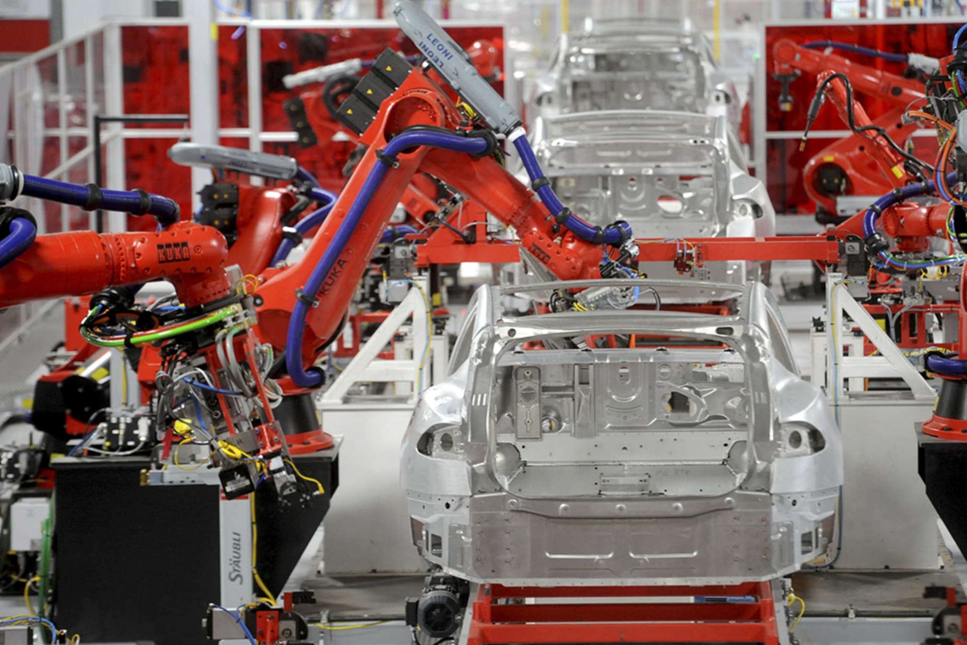 <p>Robotic arms assemble Tesla’s Model S sedans at the company’s factory in Fremont, California, on June 22, 2012. </p>
