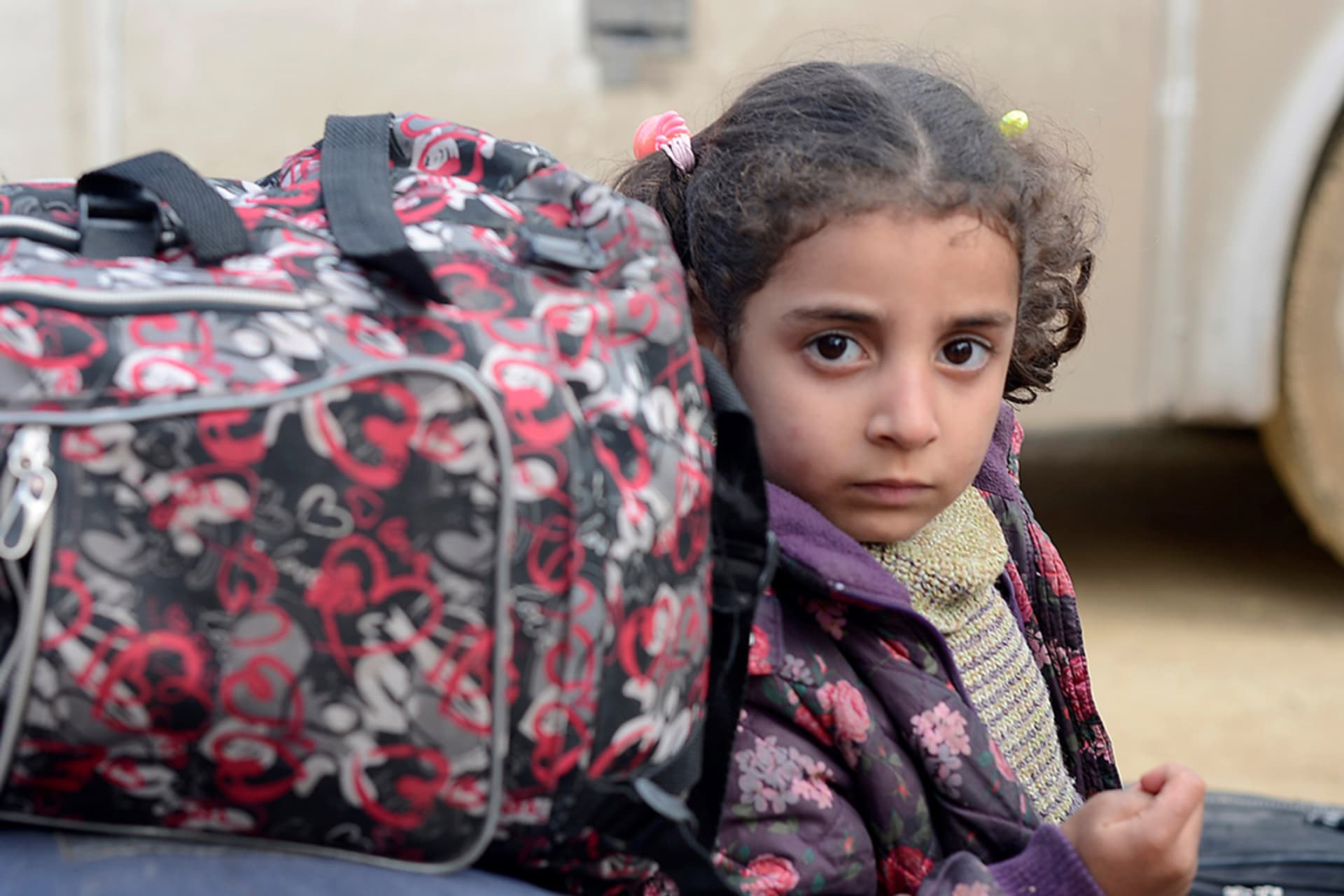<p>A girl evacuated from the Damascus suburb of Douma arrives in northern Syria.</p>
