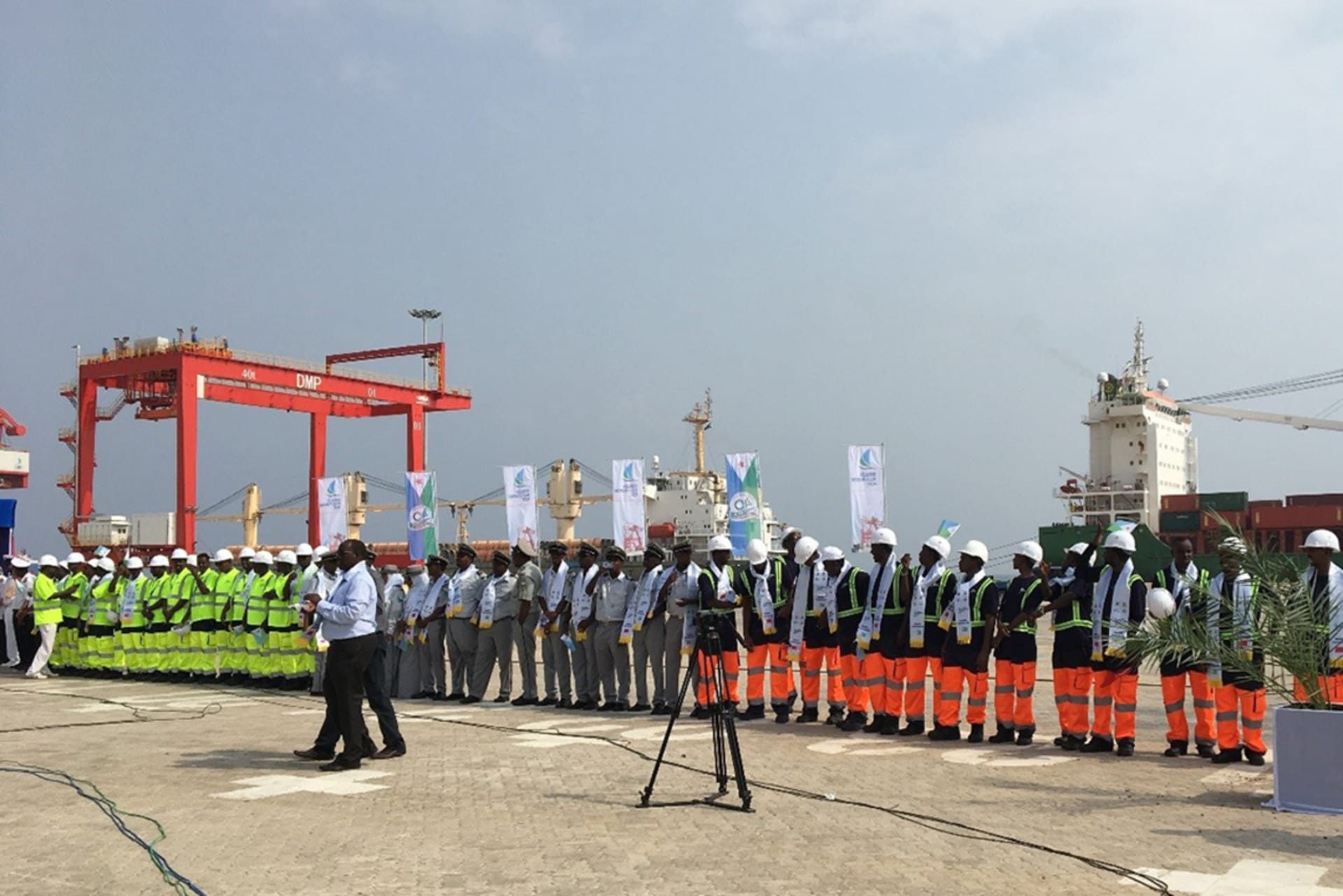 <p>Djiboutian workers stand at the opening of the Doraleh Multipurpose Port</p>
