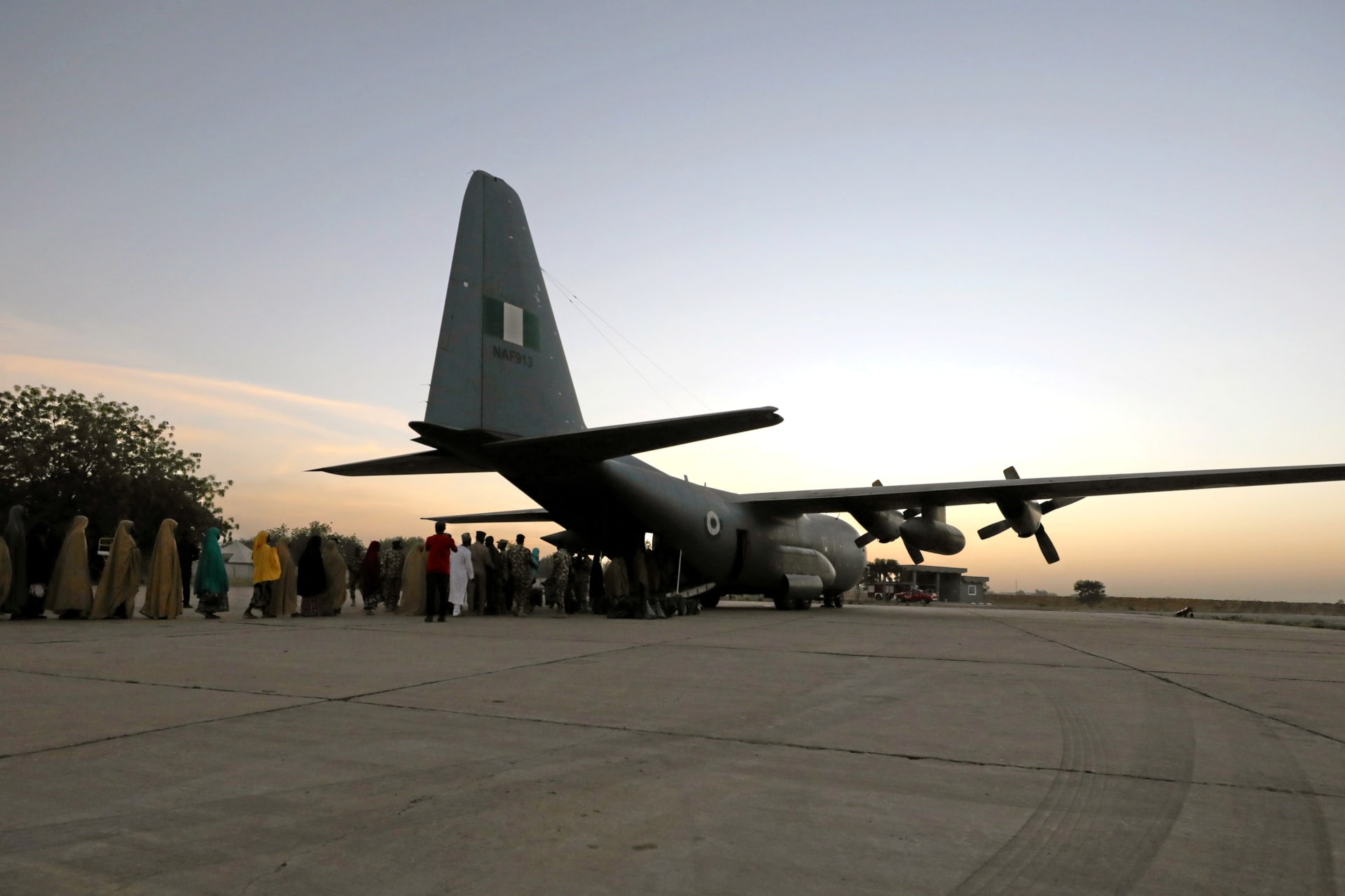 <p>Some of the newly released Dapchi schoolgirls board a plane at the air force base in Maiduguri, Nigeria March 21, 2018. The kidnappers and the Nigerian government deny that a ransom was paid or that prisoners were exchanged.</p>
