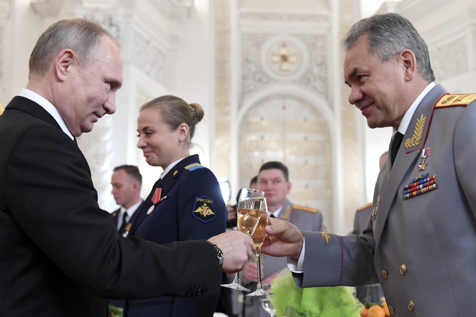 <p>Russian President Vladimir Putin toasts with Defence Minister Sergei Shoigu after a state awards ceremony for military personnel who served in Syria, at the Kremlin in December 2017. </p>