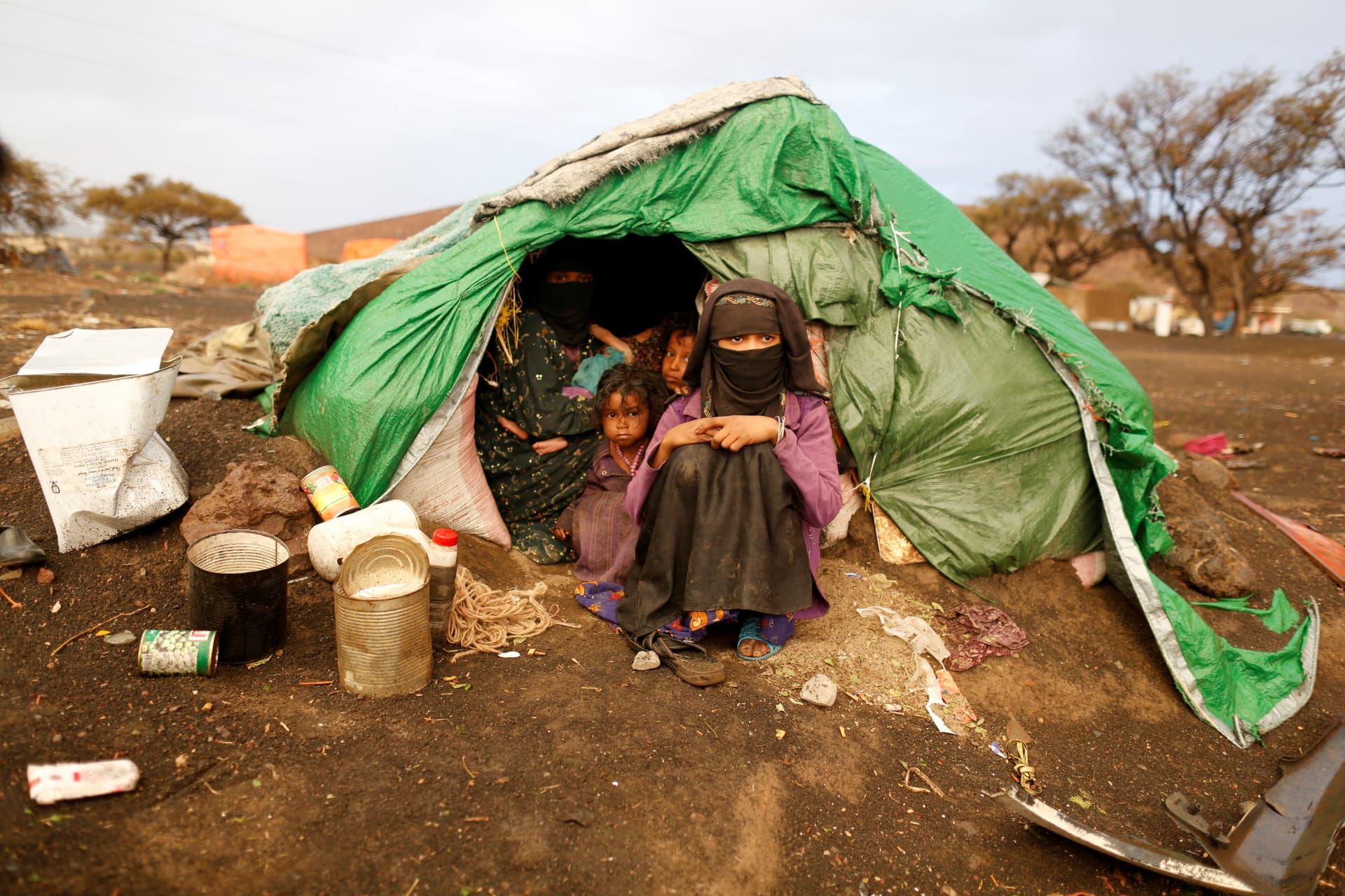 <p>A woman and girls sit in their tent at a camp for internally displaced people (IDPs) near Sanaa, Yemen March 17, 2018. </p>
