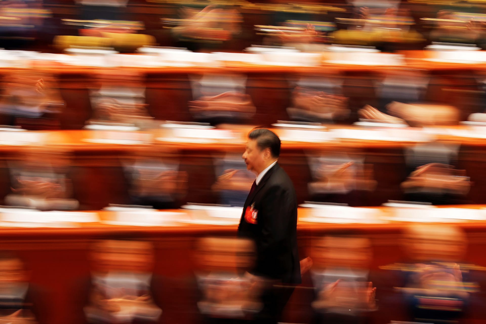 <p>Chinese President Xi Jinping walks to deliver his speech at the closing session of the National People’s Congress at the Great Hall of the People in Beijing on March 20, 2018.</p>
