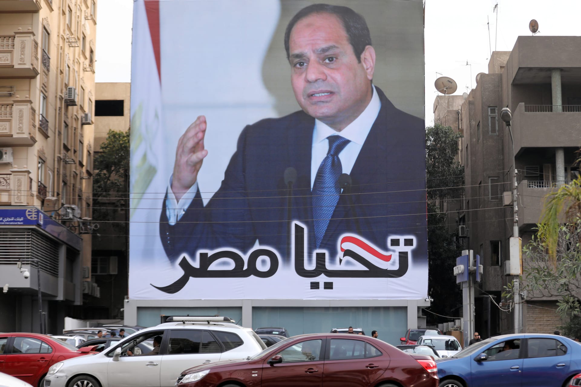 <p>Cars pass by a poster of Egypt’s President Abdel Fattah al-Sisi for the upcoming presidential election, in Cairo, Egypt, February 19, 2018. The writing on the poster reads: “Long live Egypt”.</p>
