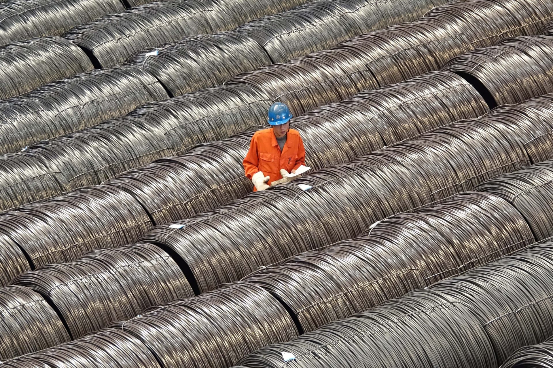 <p>A worker checks steel wires at a warehouse in Dalian, Liaoning province, China.</p>
