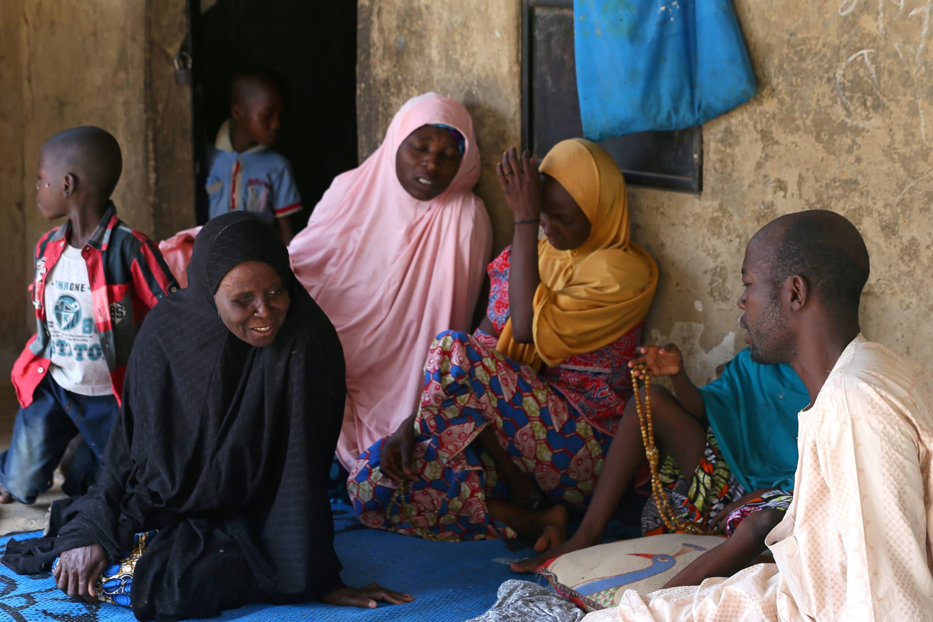 <p>Relatives of missing school girls react in Dapchi in the northeastern state of Yobe, after an attack on the village by Boko Haram, Nigeria February 23, 2018. </p>
