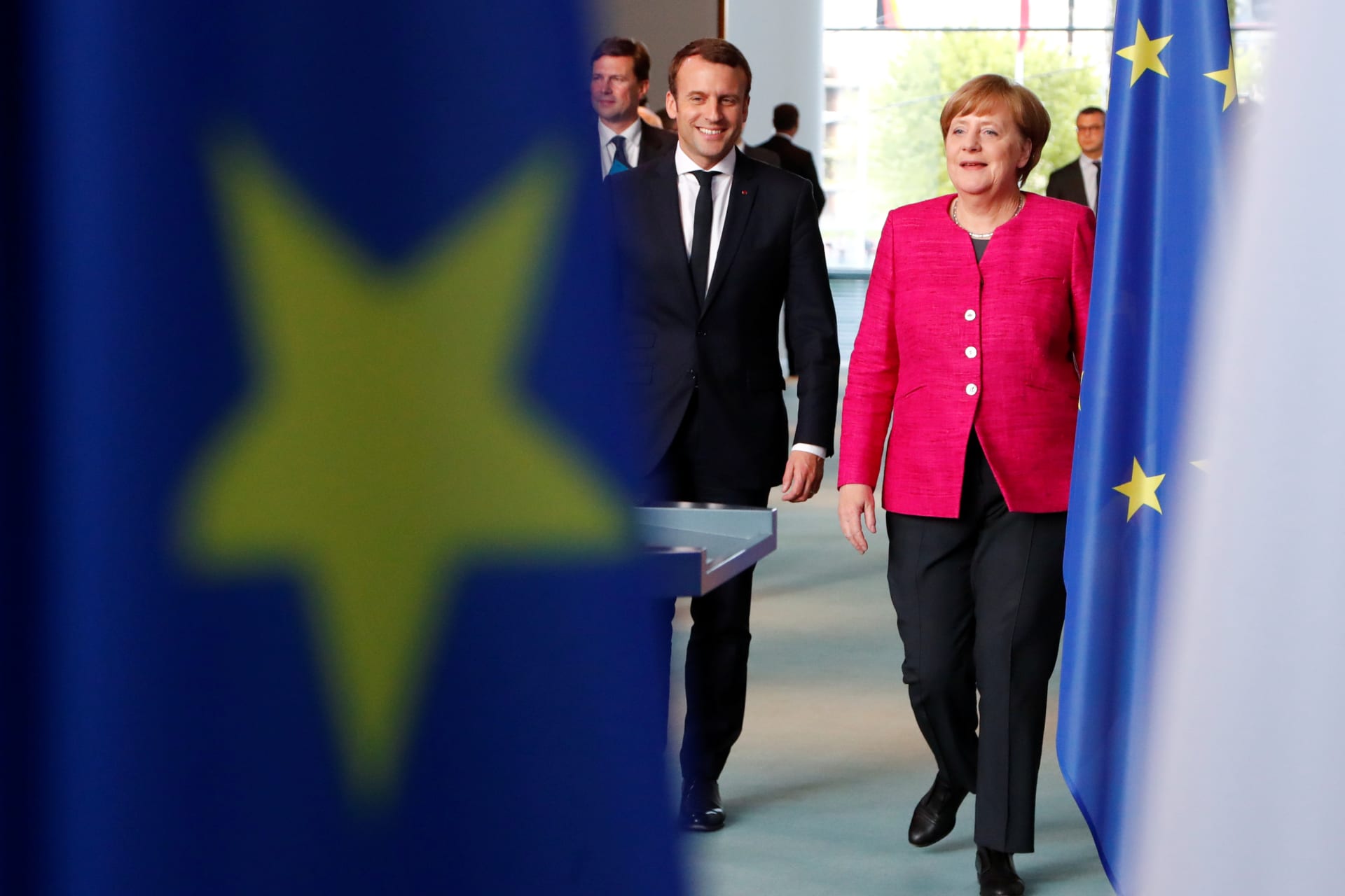 <p>German Chancellor Angela Merkel and French President Emmanuel Macron arrive to a news conference at the Chancellery in Berlin on May 15, 2017. </p>
