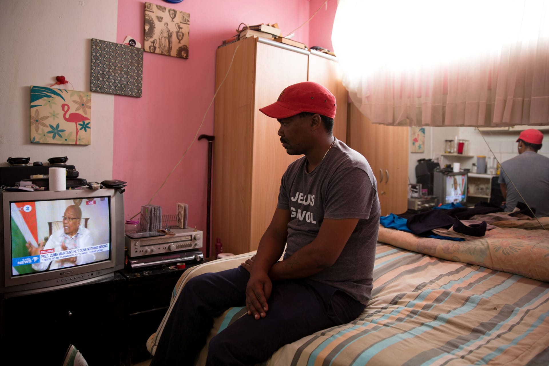 <p>A man watches as President Jacob Zuma responds to calls for him to step down, in Johannesburg, South Africa, February 14, 2018.</p>
