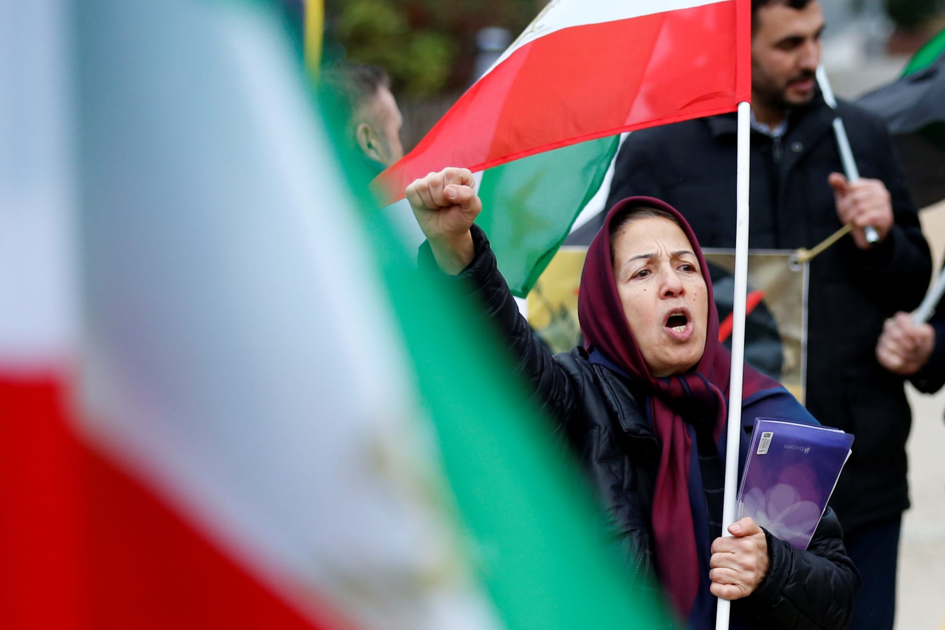 <p>An opponent of Iranian President Hassan Rouhani chants slogans during a protest outside the European Union Council in Brussels, Belgium January 3, 2018. </p>
