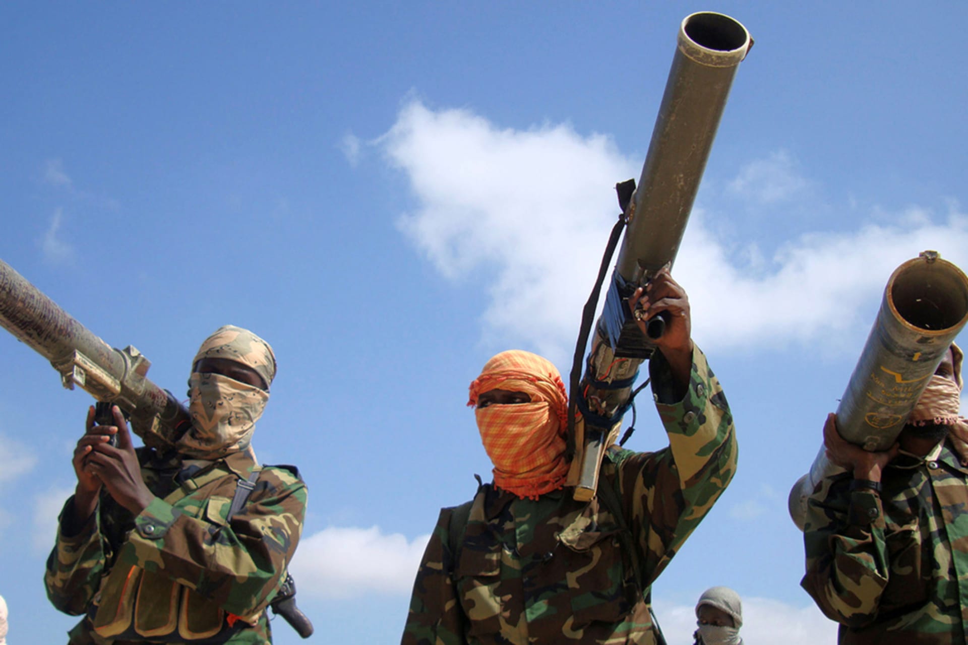 <p> Members of Somalia’s al-Qaeda linked al Shabaab militia hold their weapons in Mogadishu, Somalia January 1, 2010.</p>